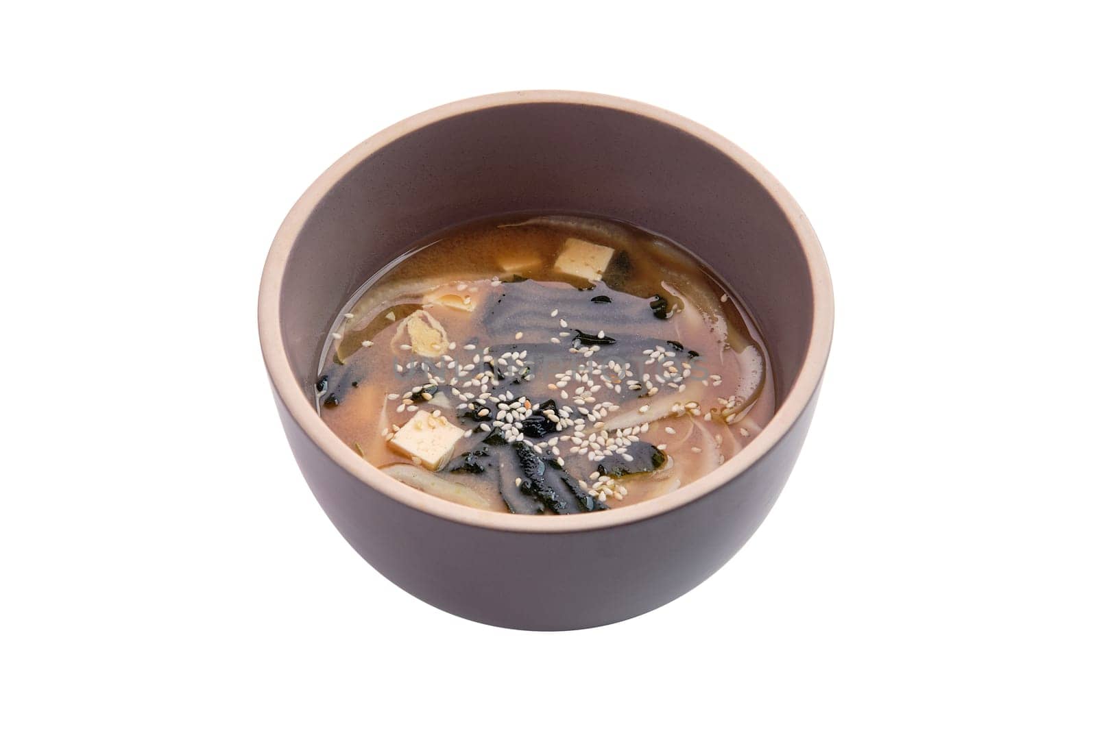 Soup with noodles, sea wed and tofu isolated on white background