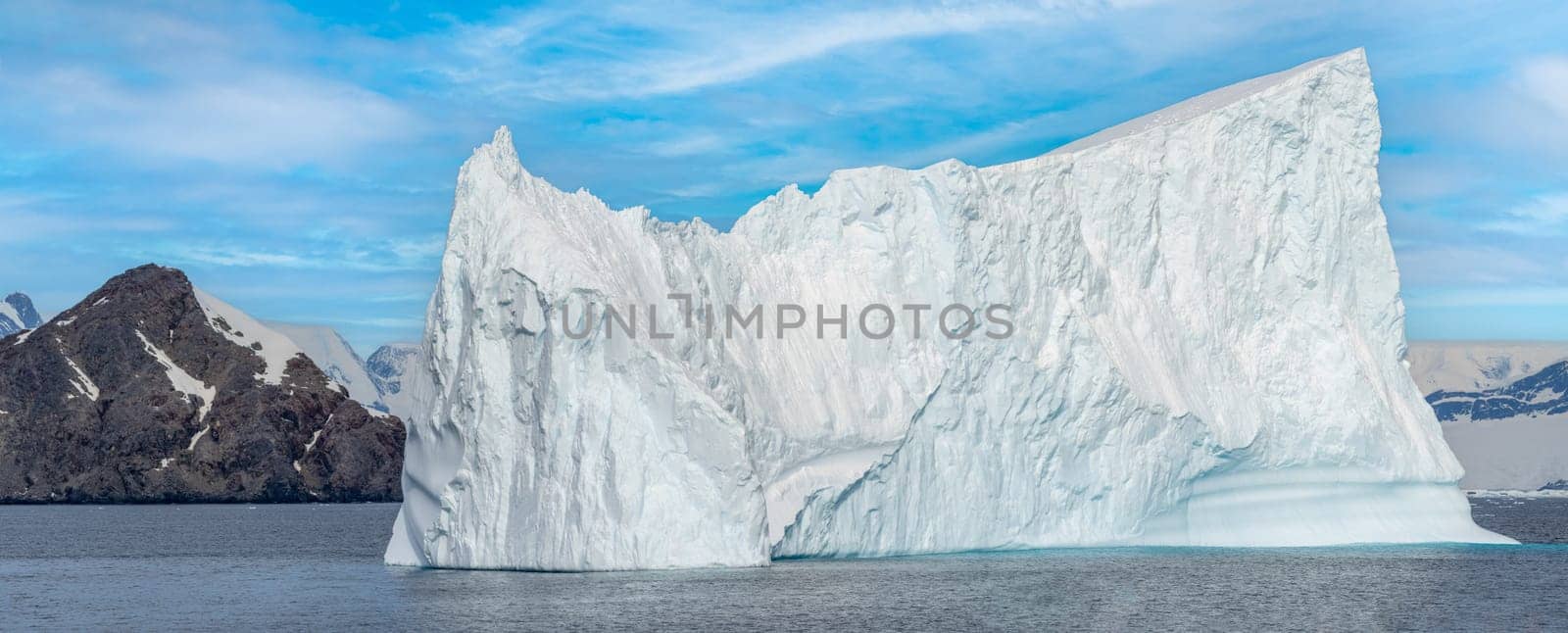 Antarctic iceberg landscape in Cierva Cove - a deep inlet on the west side of the Antarctic Peninsula, surrounded by rugged mountains and dramatic glacier fronts.