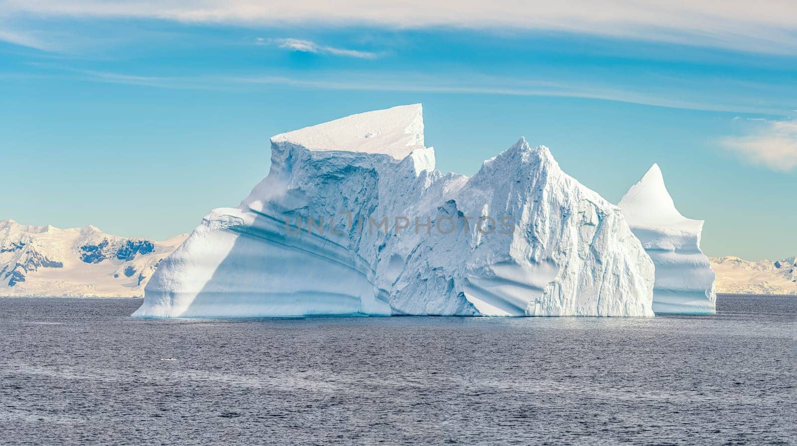 Antarctic iceberg landscape in Cierva Cove - a deep inlet on the west side of the Antarctic Peninsula, surrounded by rugged mountains and dramatic glacier fronts.
