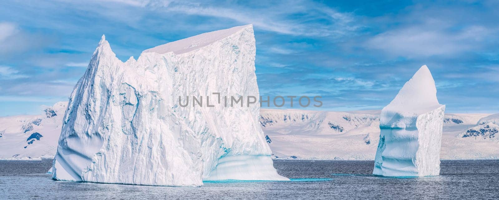 Antarctic iceberg landscape in Cierva Cove - a deep inlet on the west side of the Antarctic Peninsula, surrounded by rugged mountains and dramatic glacier fronts.