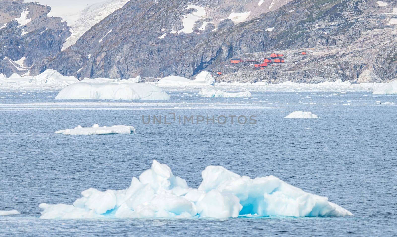 Antarctic iceberg landscape in Cierva Cove - a deep inlet on the west side of the Antarctic Peninsula, surrounded by rugged mountains and dramatic glacier fronts.