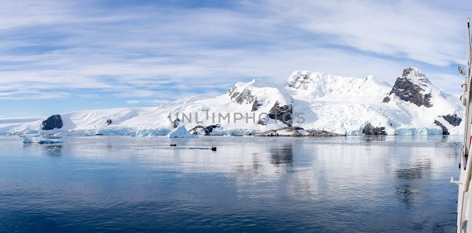 Antarctic iceberg landscape in Cierva Cove - a deep inlet on the west side of the Antarctic Peninsula, surrounded by rugged mountains and dramatic glacier fronts.