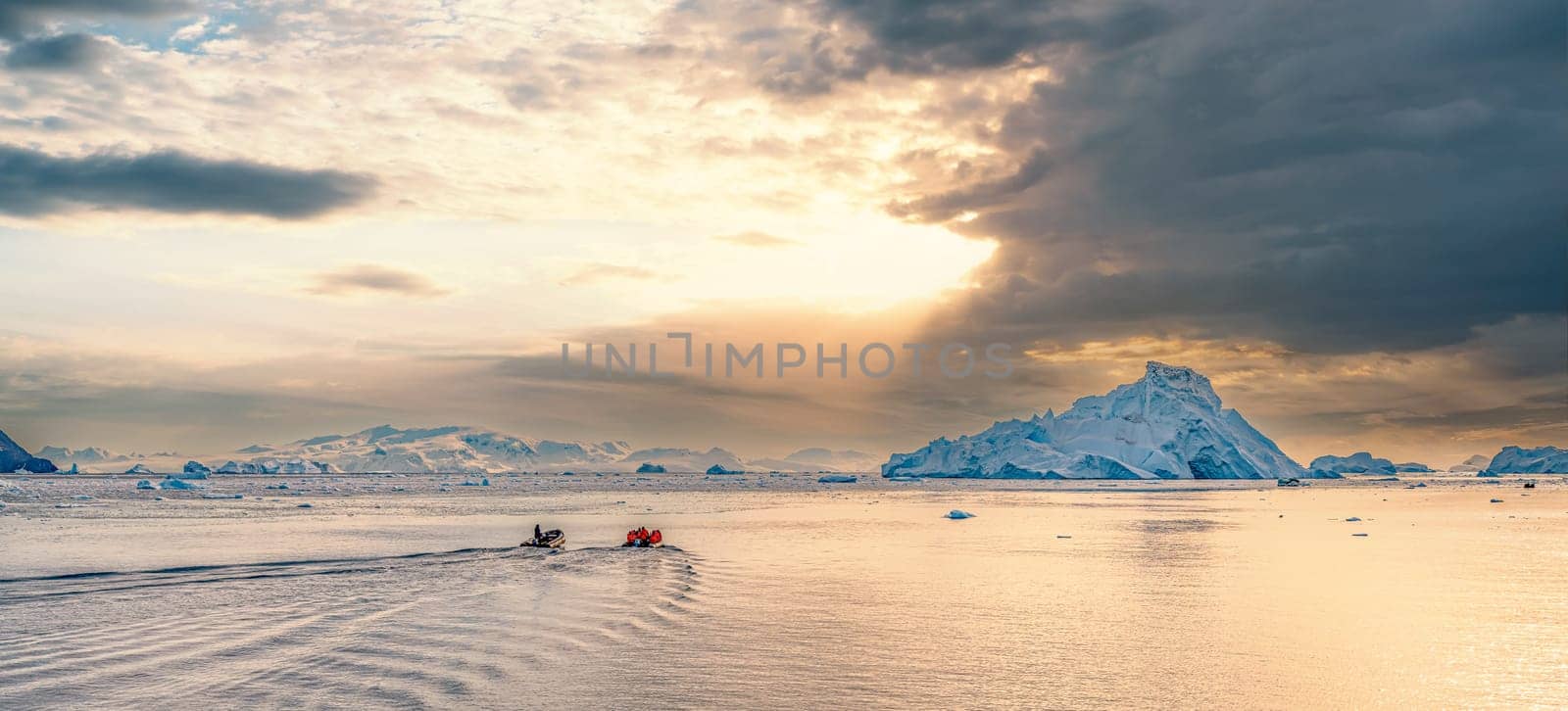 Antarctic iceberg landscape in Cierva Cove - a deep inlet on the west side of the Antarctic Peninsula, surrounded by rugged mountains and dramatic glacier fronts.
