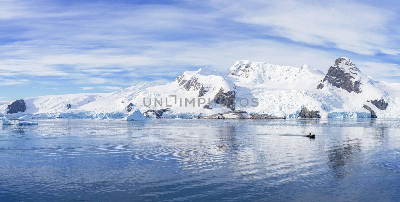 Antarctic iceberg landscape in Cierva Cove - a deep inlet on the west side of the Antarctic Peninsula, surrounded by rugged mountains and dramatic glacier fronts.