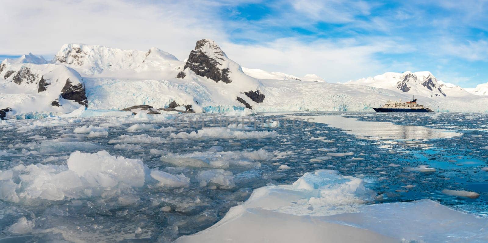 Antarctic iceberg landscape in Cierva Cove - a deep inlet on the west side of the Antarctic Peninsula, surrounded by rugged mountains and dramatic glacier fronts.
