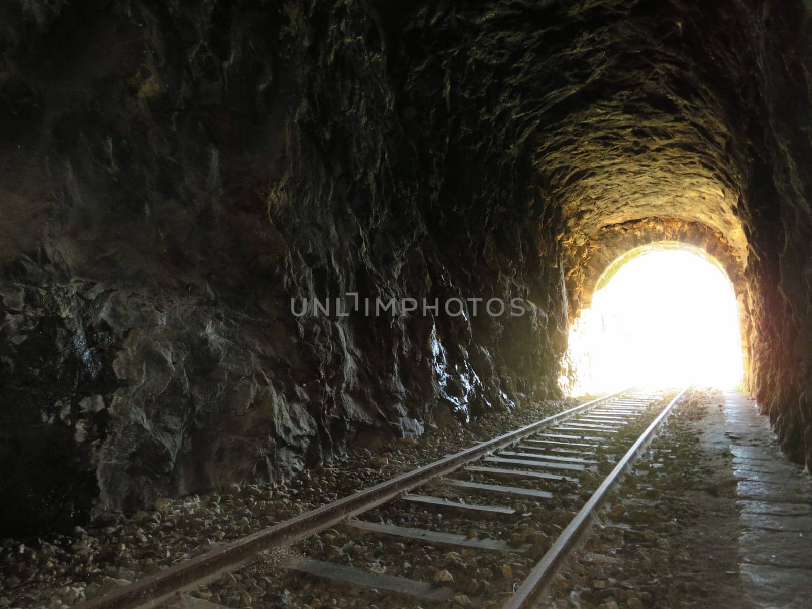 iron road bridges metal rail light at the end of the tunnel train transport
