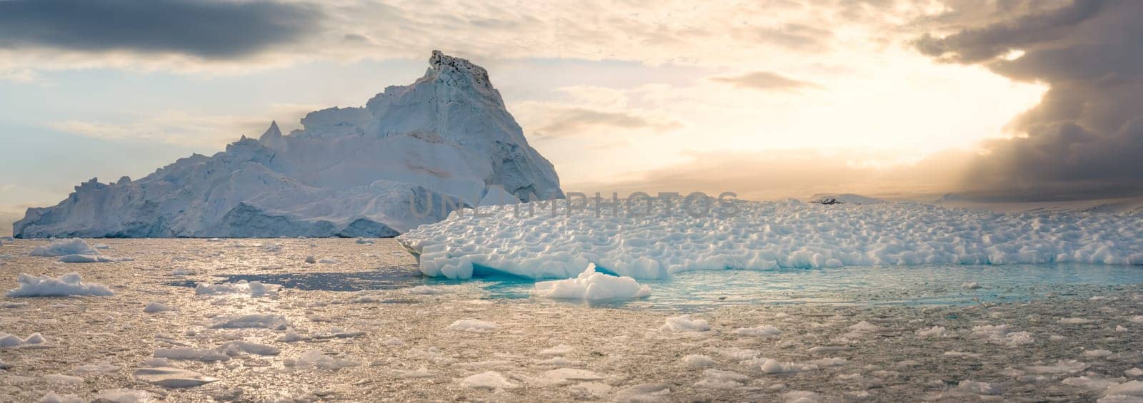 Antarctic iceberg landscape in Cierva Cove - a deep inlet on the west side of the Antarctic Peninsula, surrounded by rugged mountains and dramatic glacier fronts.
