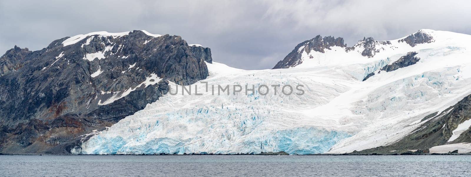 Antarctic iceberg landscape in Cierva Cove - a deep inlet on the west side of the Antarctic Peninsula, surrounded by rugged mountains and dramatic glacier fronts.
