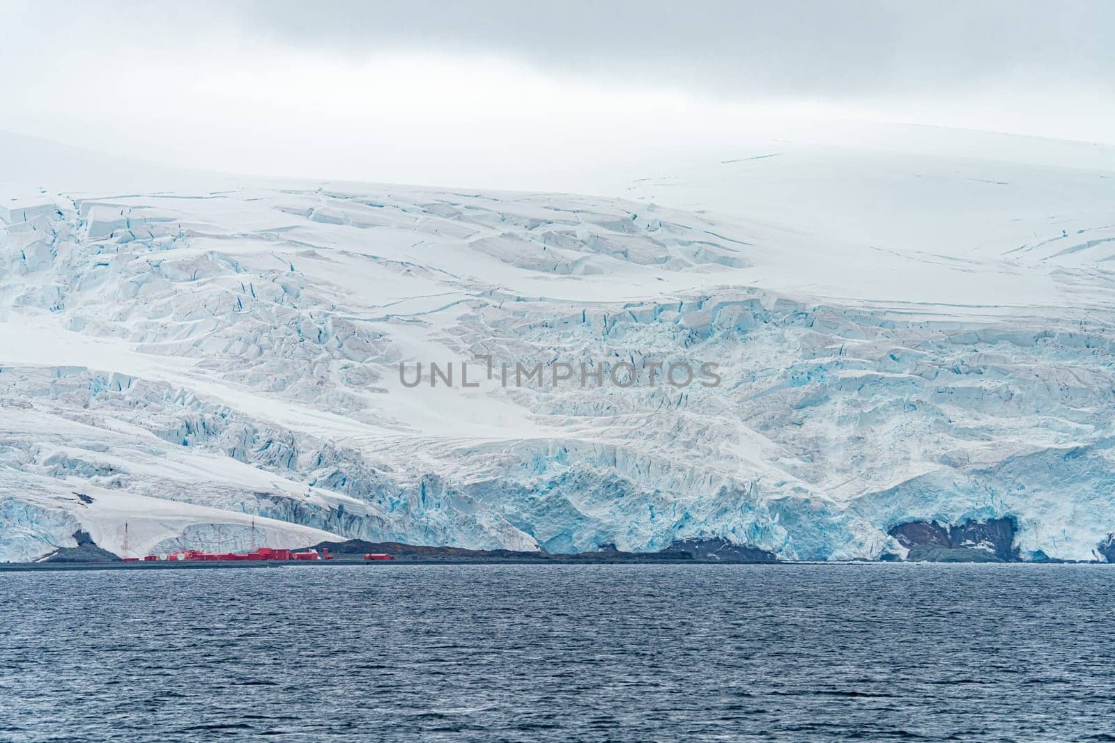 Antarctic iceberg landscape in Cierva Cove - a deep inlet on the west side of the Antarctic Peninsula, surrounded by rugged mountains and dramatic glacier fronts.