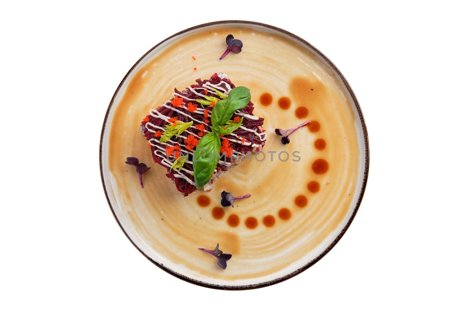 Salad with herring, beet, potato, carrot and caviar isolated on white background