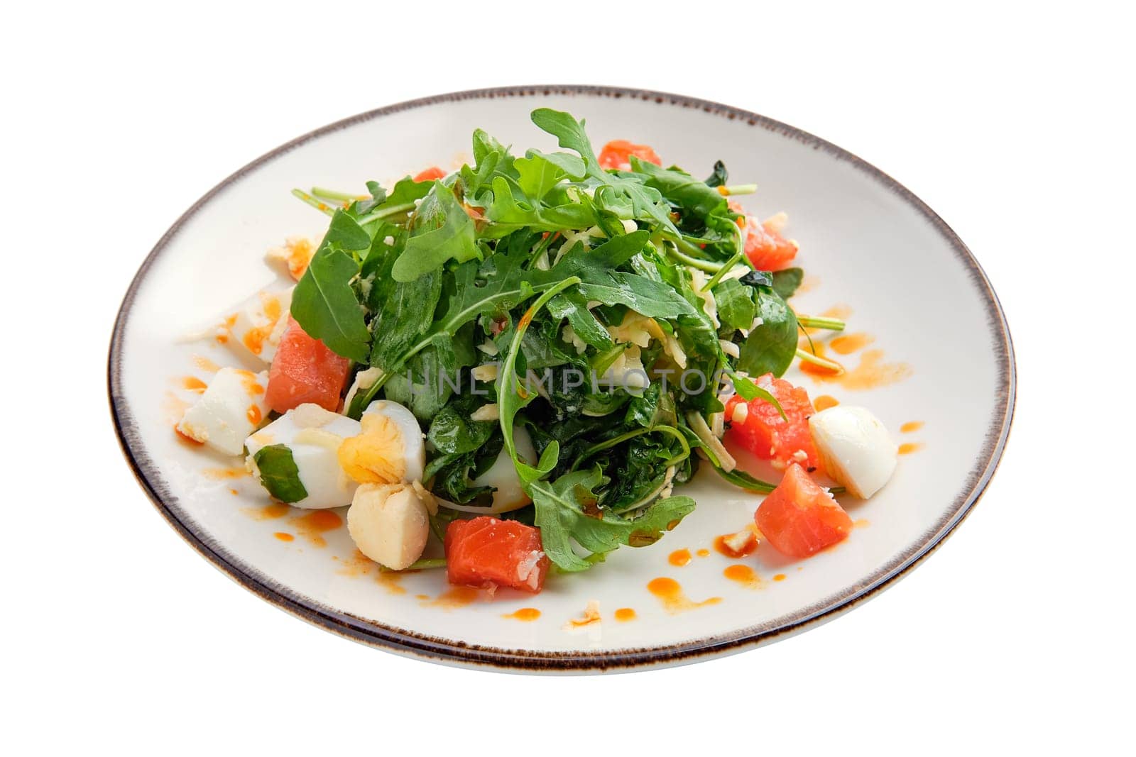 Salad with salmon, egg, cheese and arugula isolated on white background