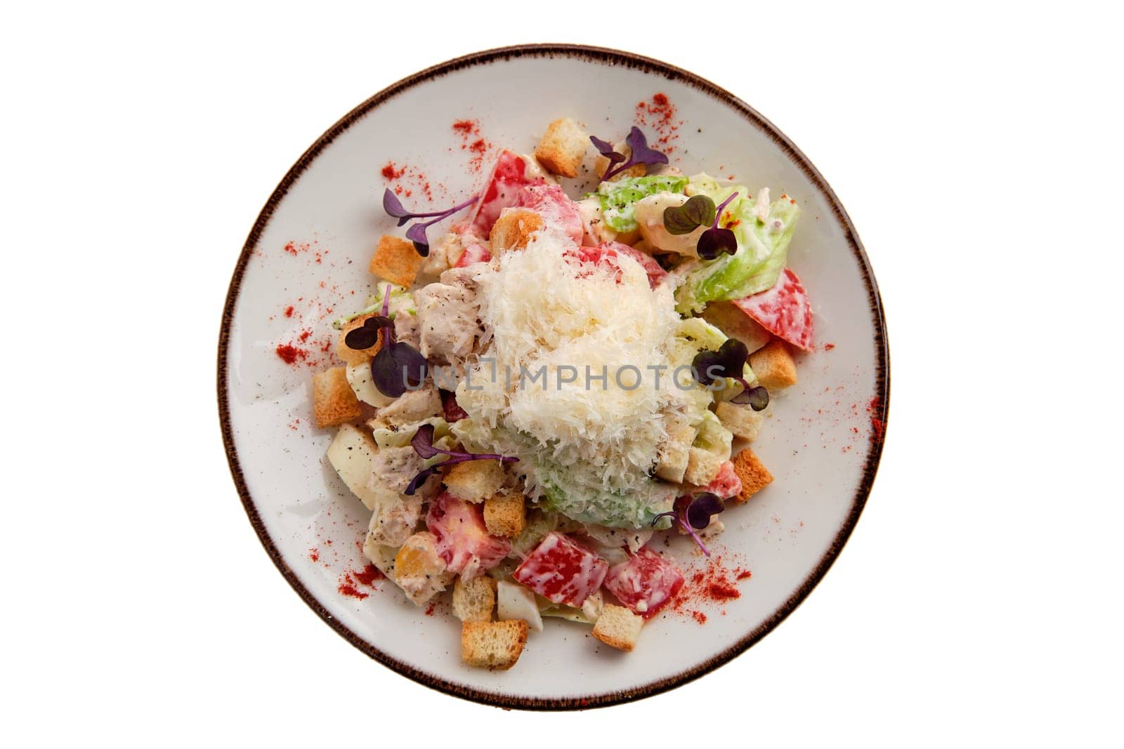 Salad with chicken, cheese, tomato, cabbage and crouton isolated on white background