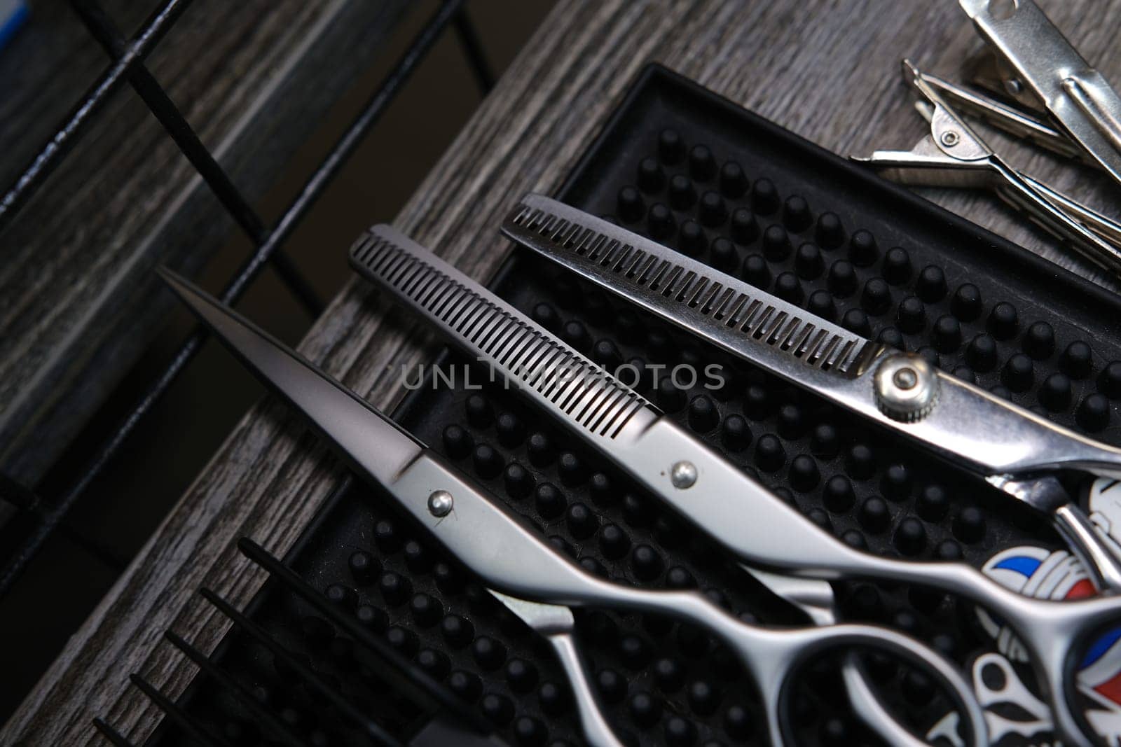 Vintage barber shop tools on old wooden background and rubber mat.