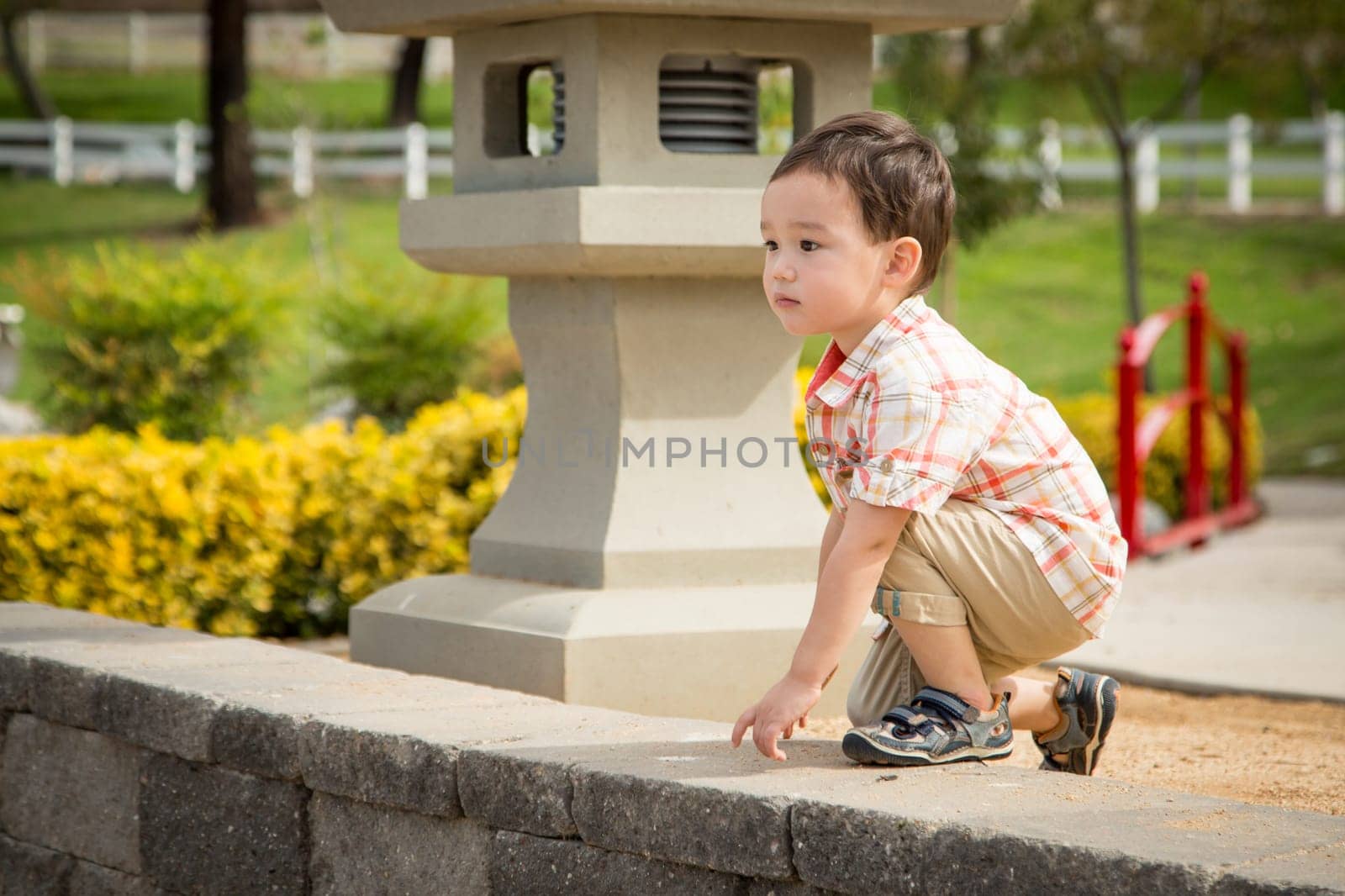 Young Chinese and Caucasian Boy Having Fun at the Park.
