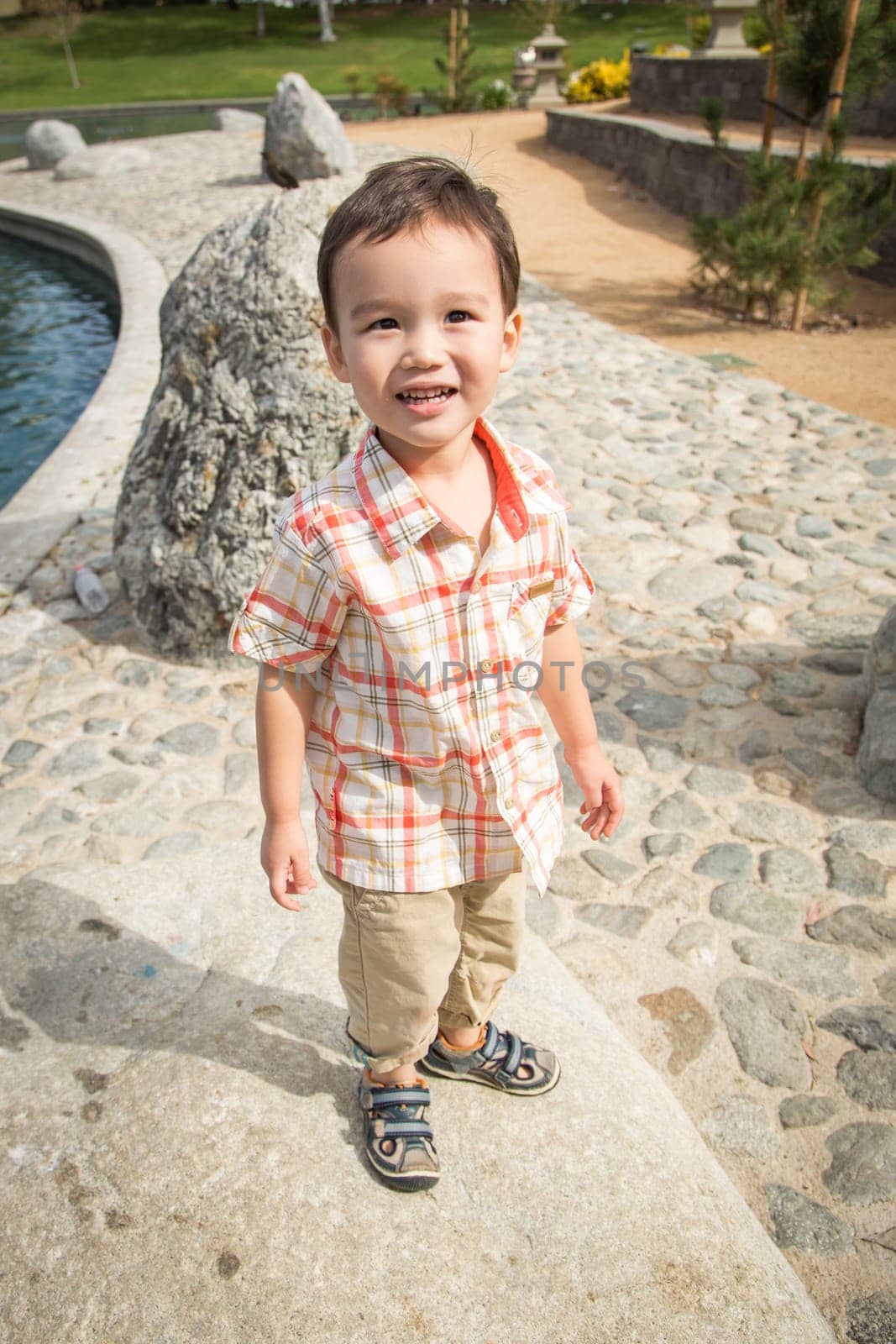 Young Chinese and Caucasian Boy Having Fun at the Park.