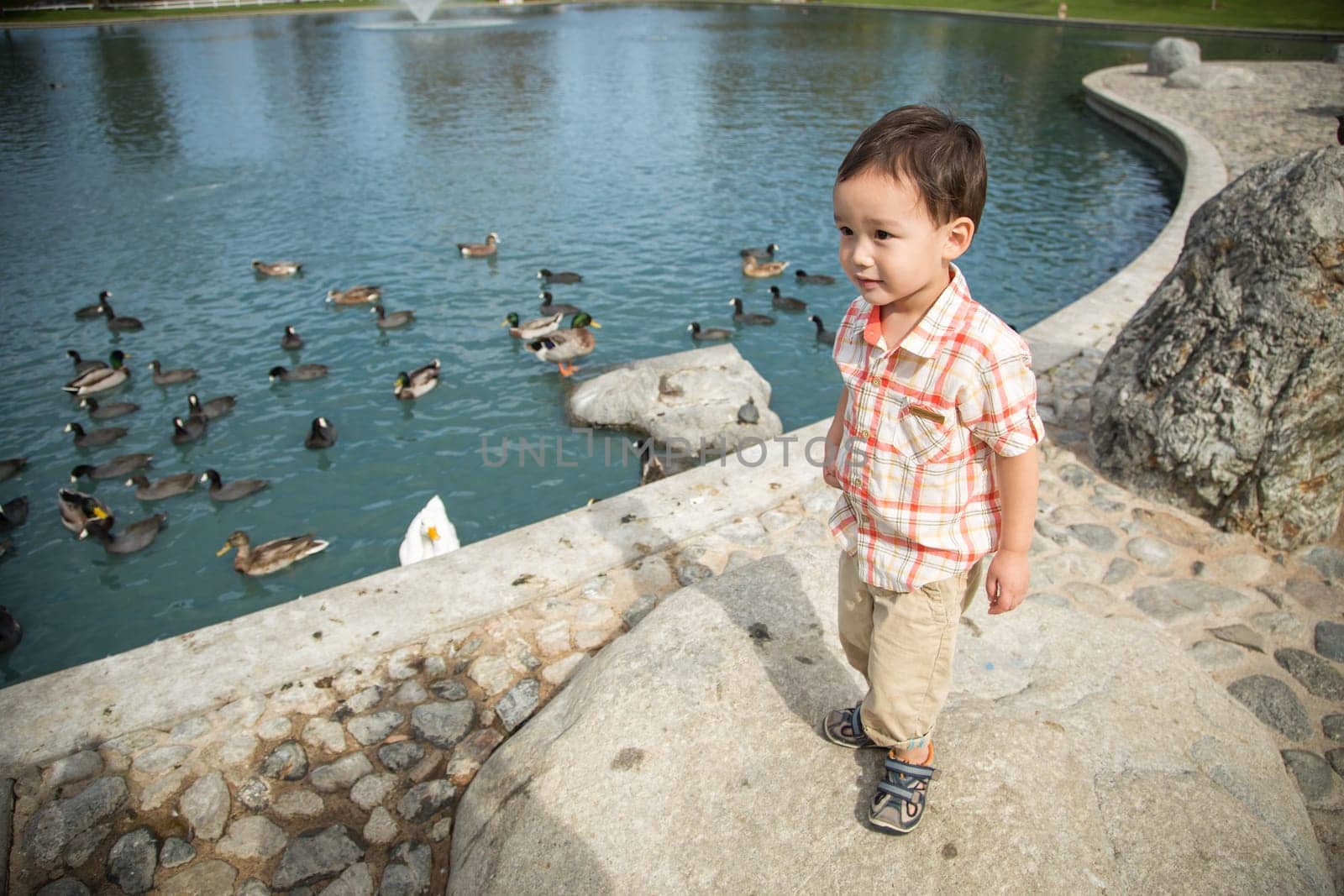 Young Chinese and Caucasian Boy Having Fun at the Park.