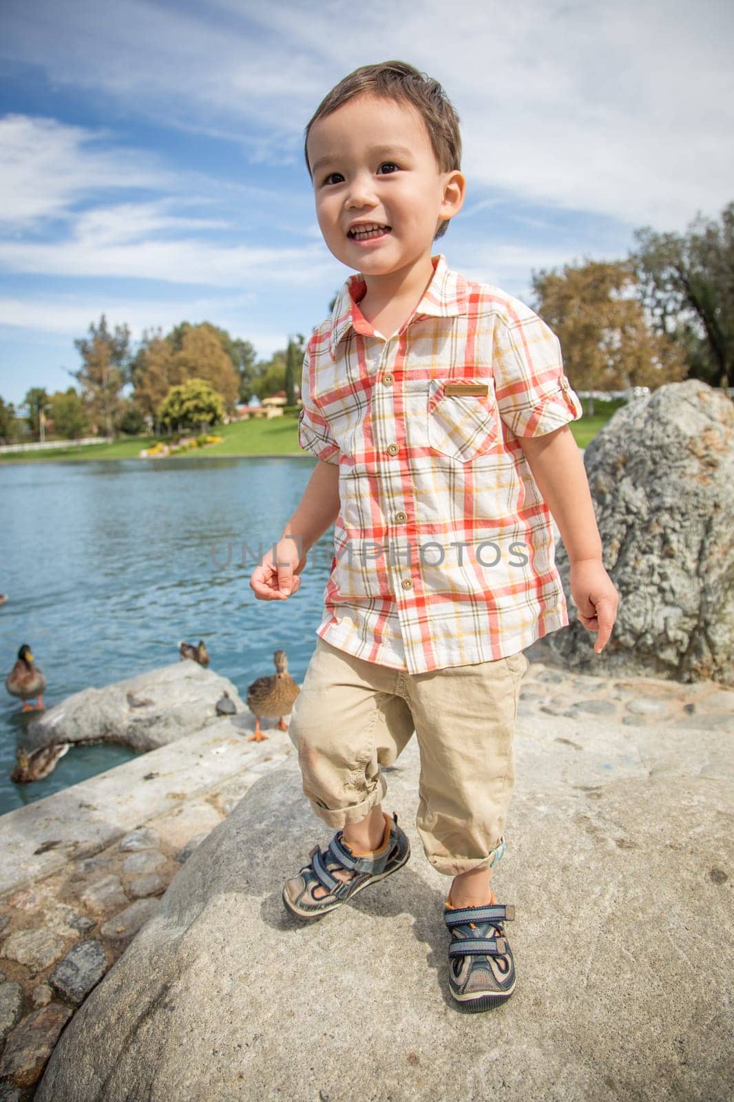 Young Chinese and Caucasian Boy Having Fun at the Park.