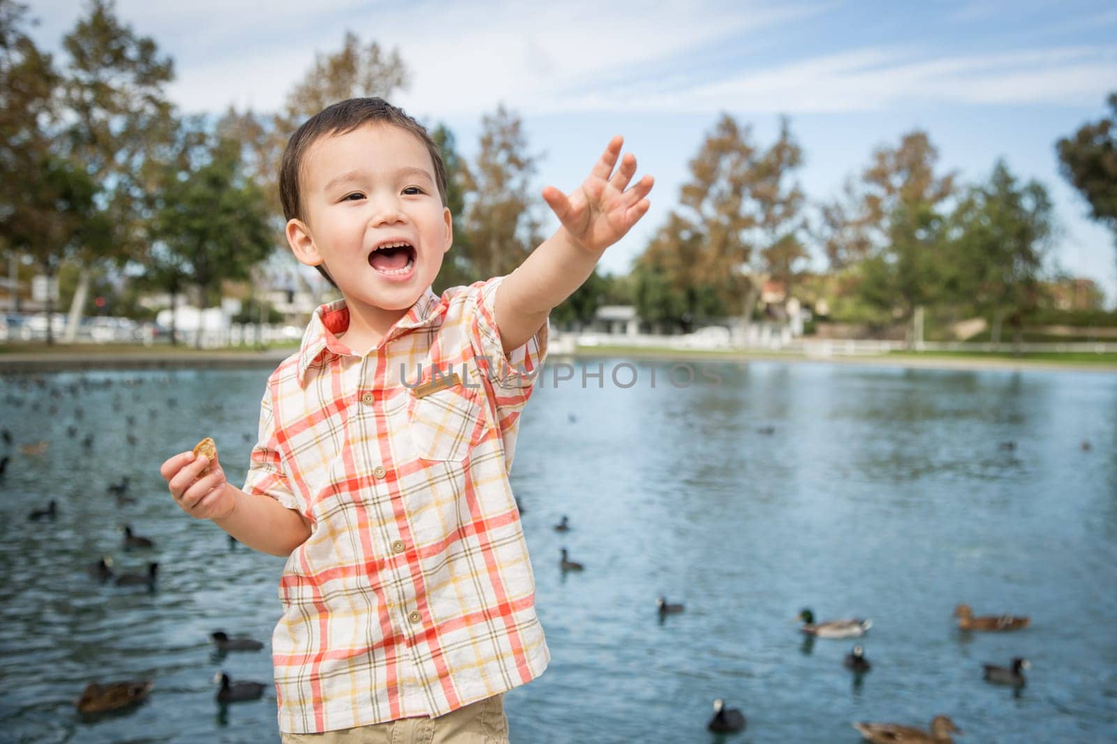 Young Chinese and Caucasian Boy Having Fun at the Park.