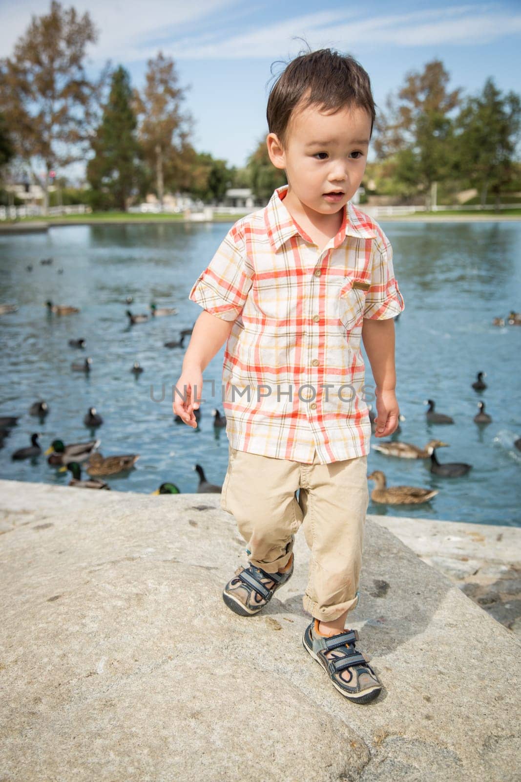 Young Chinese and Caucasian Boy Having Fun at the Park.