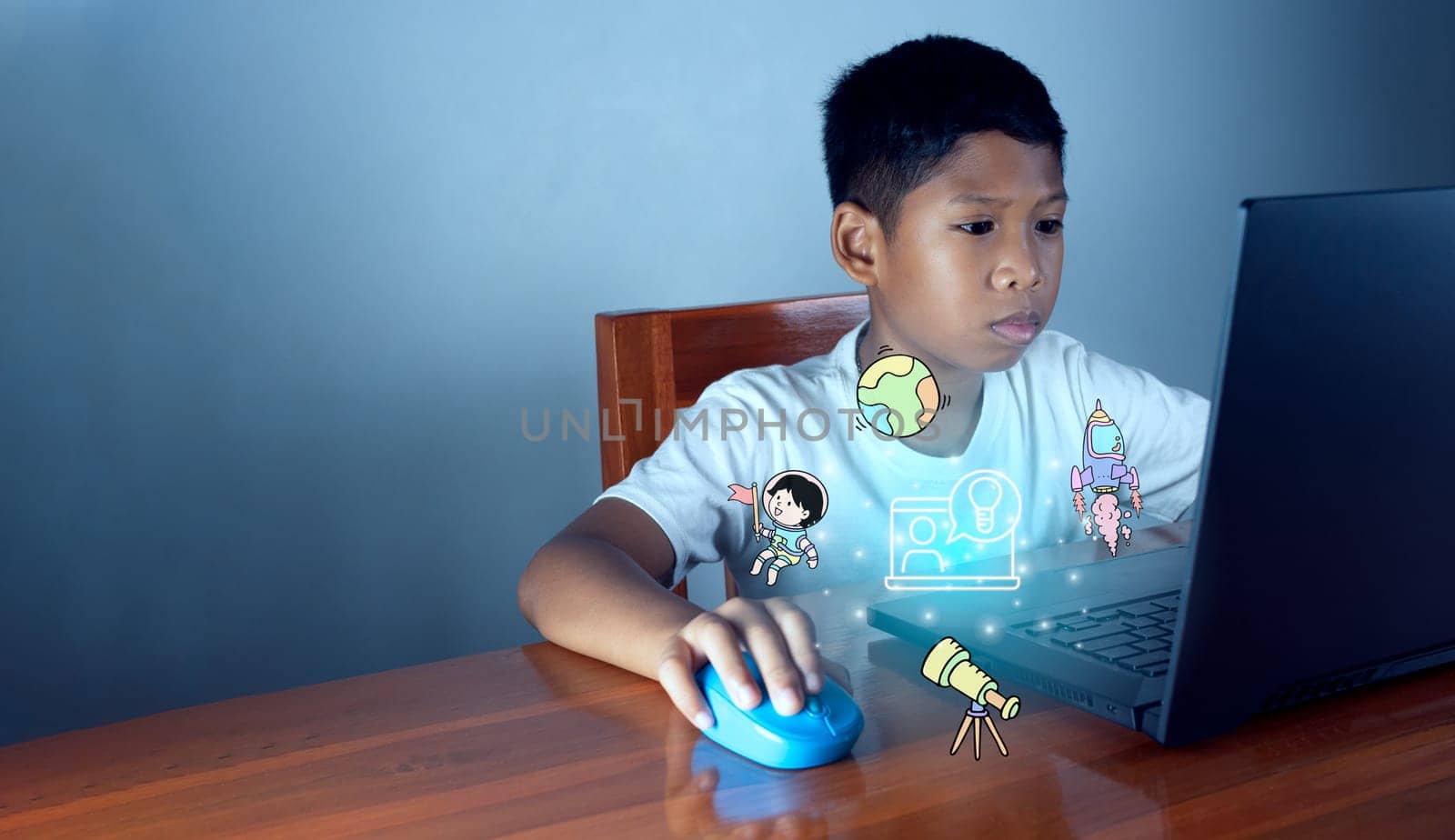 Education concept image. Creative idea and innovation. boy sitting staring at computer and there is an educational icon on the front.