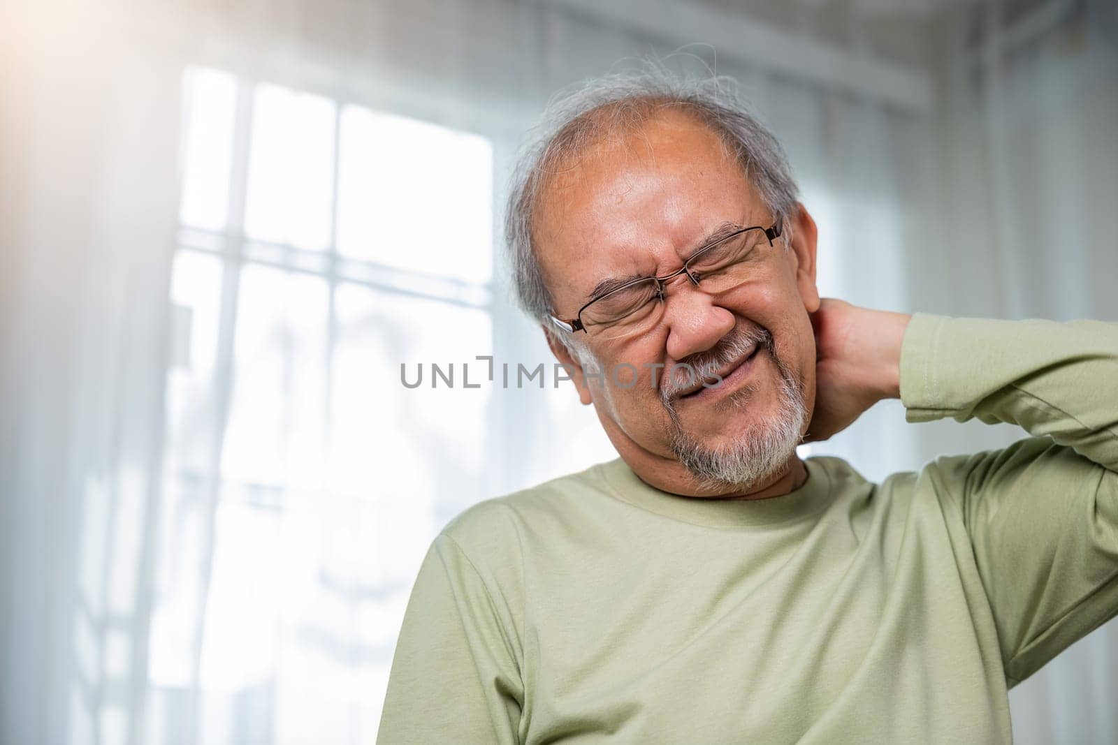 Old man suffering from nape neck pain at home, Elderly acute neckaches, Sad senior man neckache hand holding neck, Old age retirement health problems unhealthy diseased, shoulder pain
