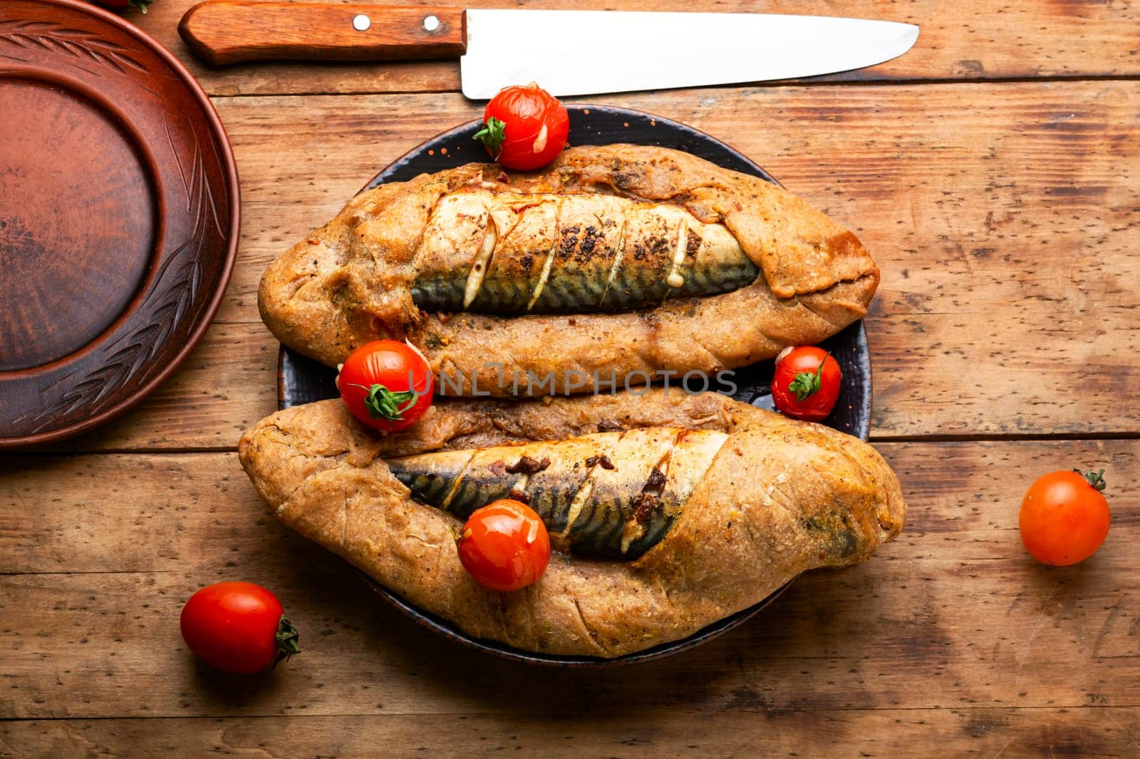 Seafood, mackerel roasted in spicy dough. Fish baked in dough