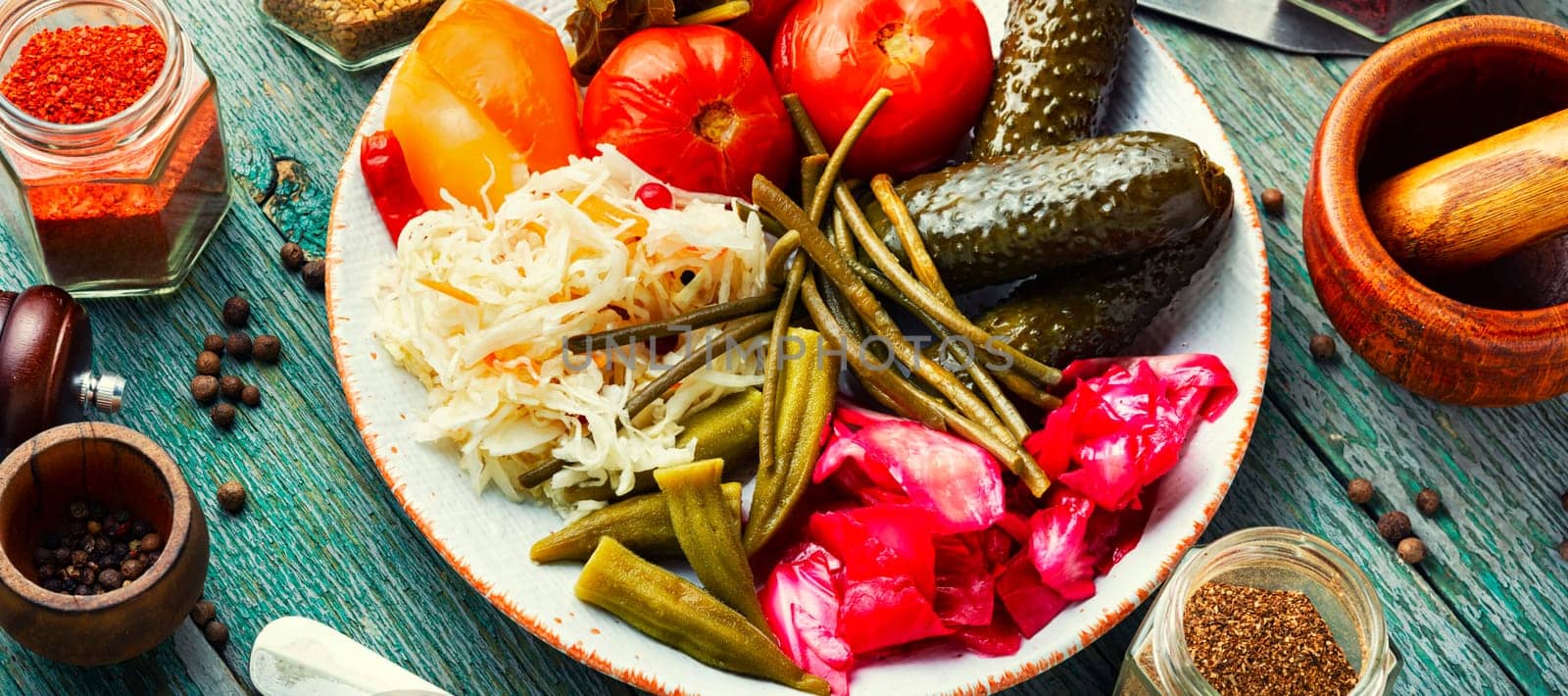 Assorted of pickles from tomato, sauerkraut, okra, cucumbers and cowpea. Pickles and marinated vegetables