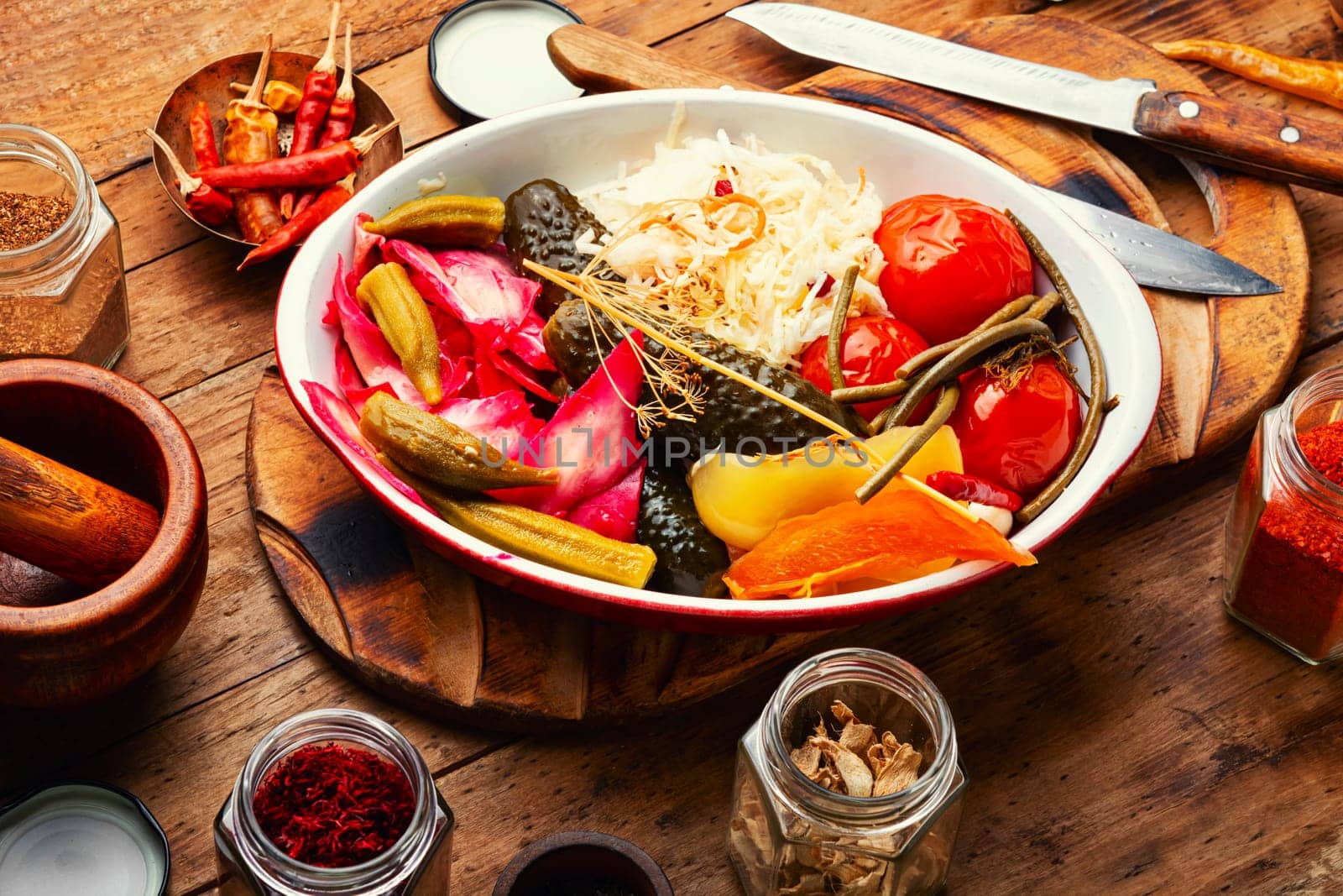 Assorted of pickles from tomato, sauerkraut, okra, cucumbers and cowpea. Pickles and marinated vegetables