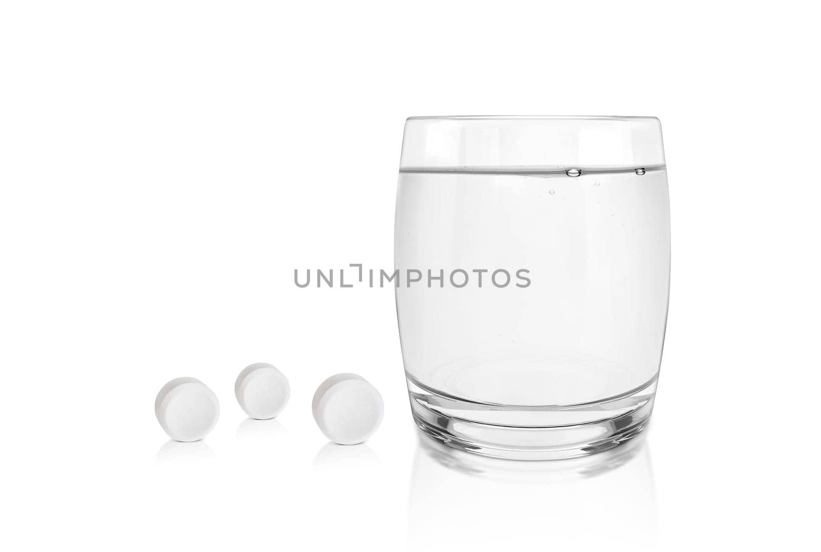 Painkiller and glass of water on white background