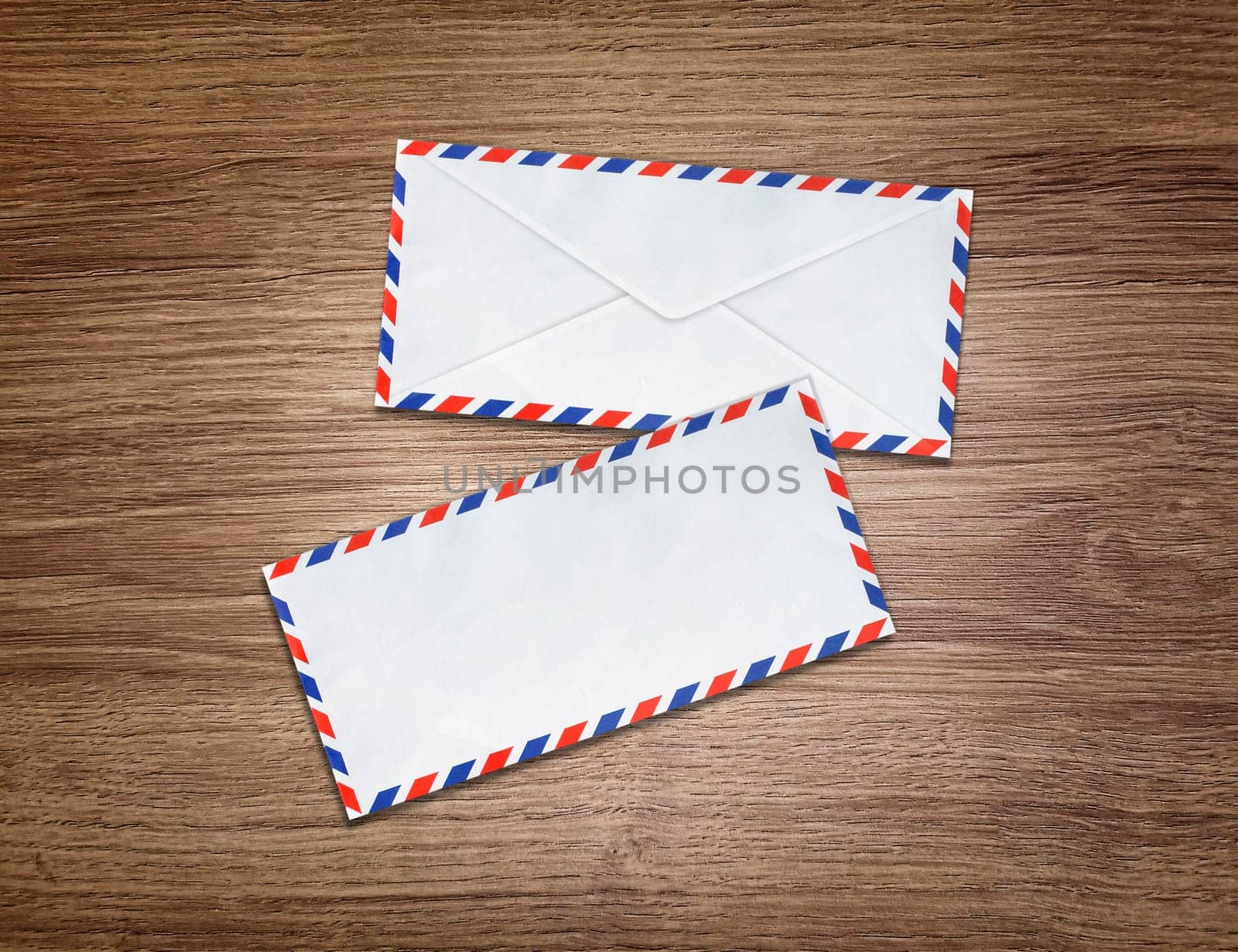 Mail envelopes on wooden floor