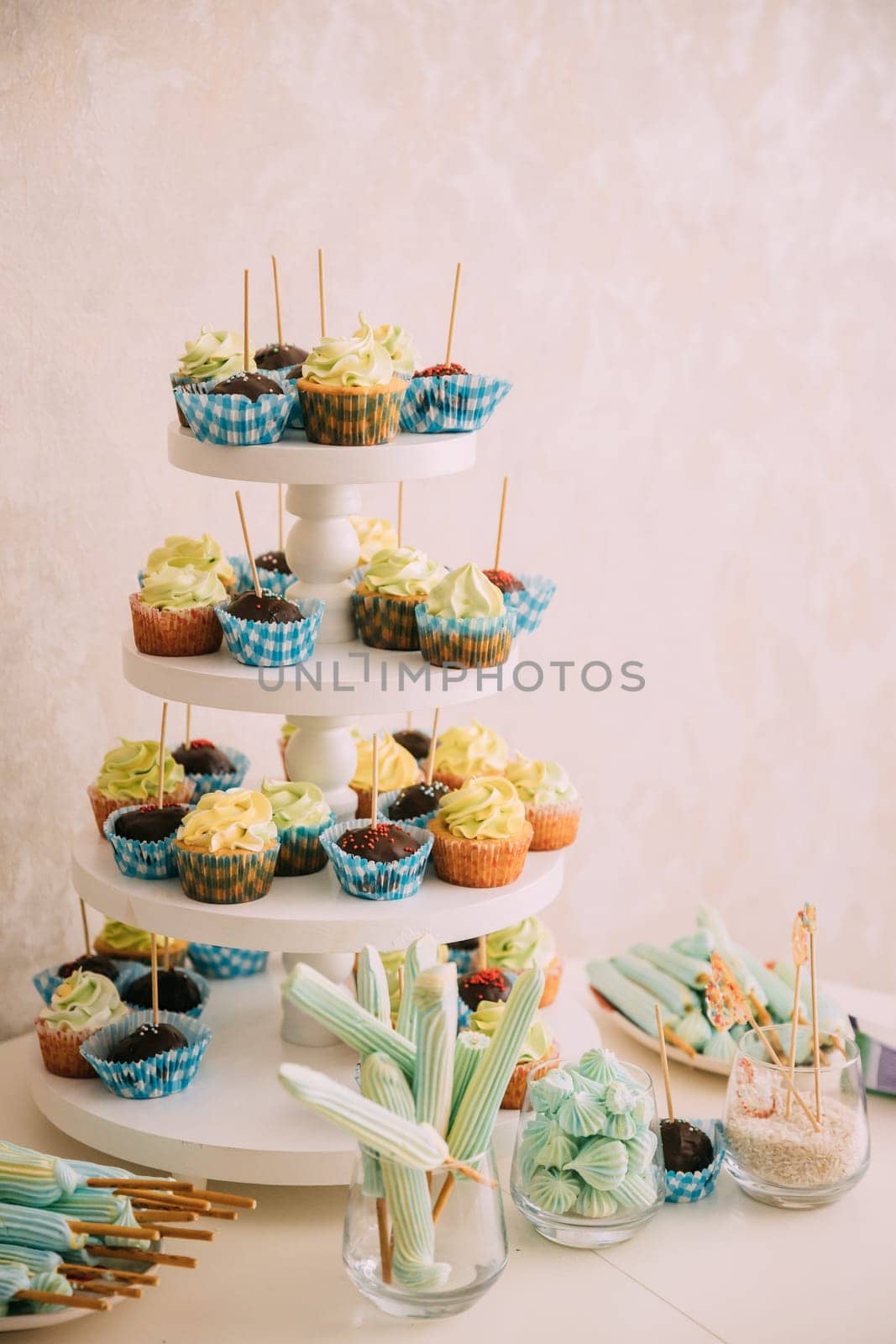 Dessert Sweet Tasty cupcake in Candy Bar On Table. Delicious sweet buffet.