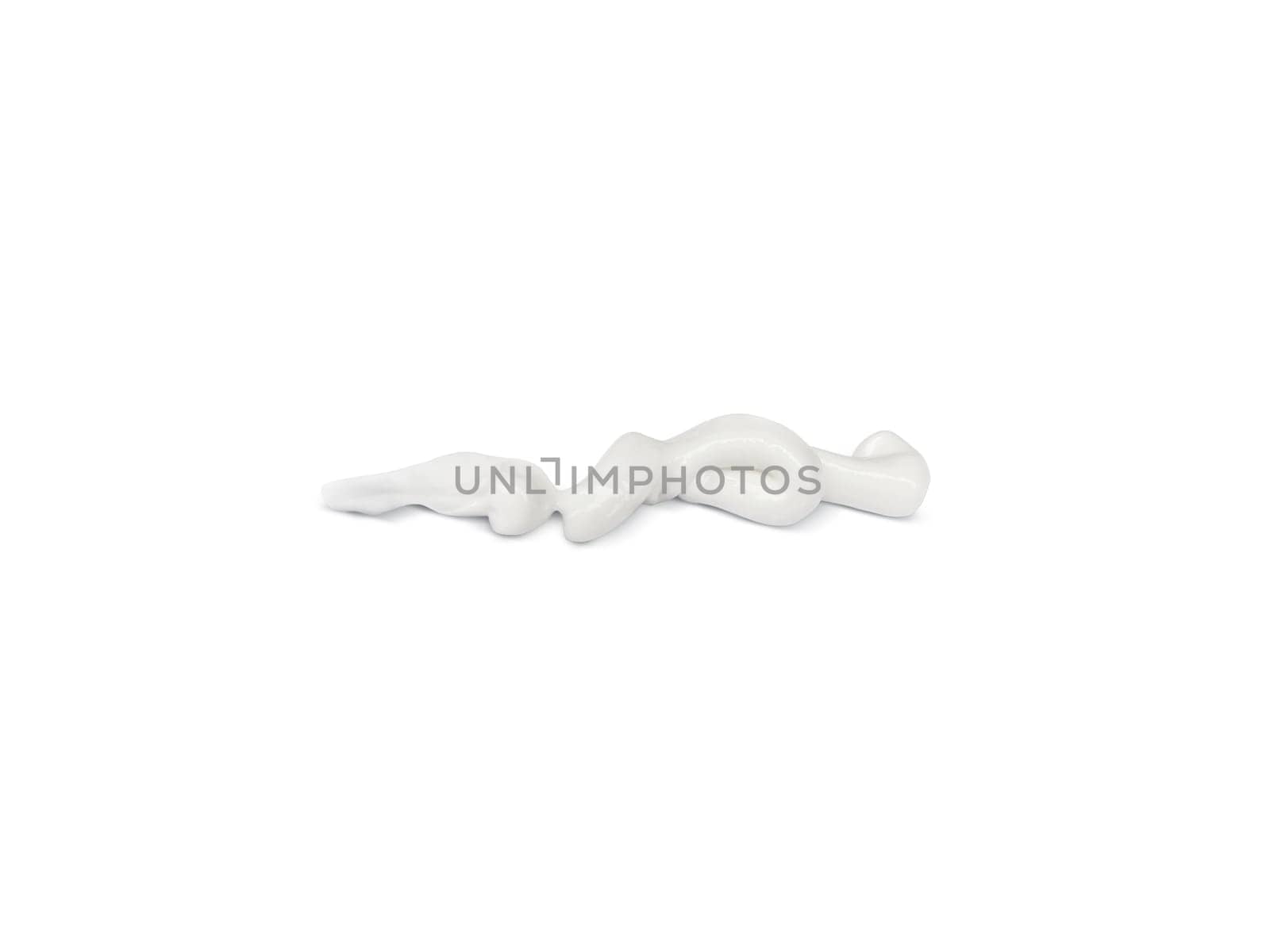 White cosmetic cream or acrylic paint is painted white on a white background
