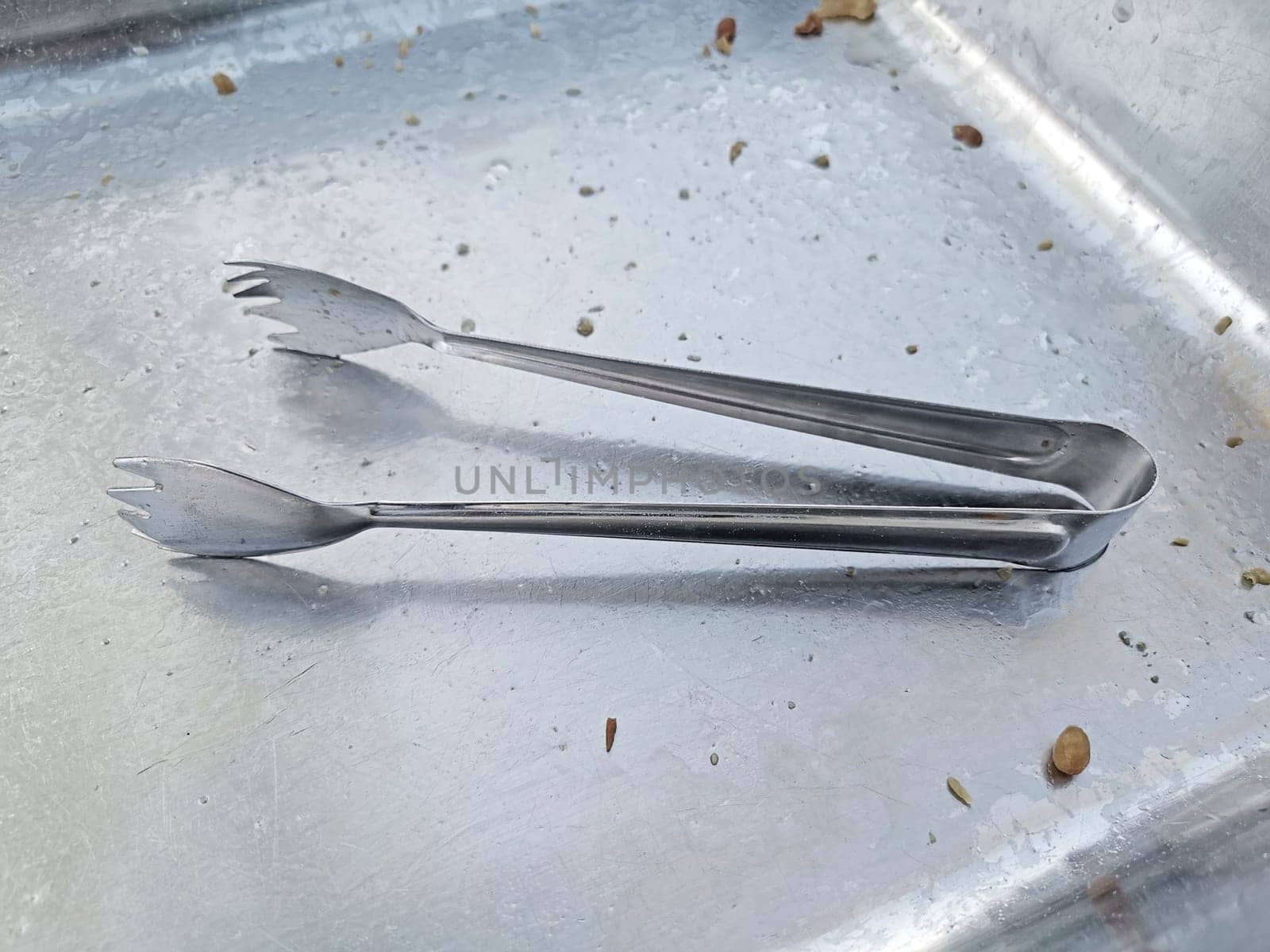 tongs. tongs are a tool for grabbing food, etc