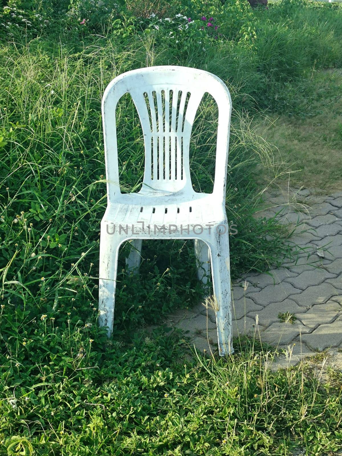 old plastic chair in the meadow