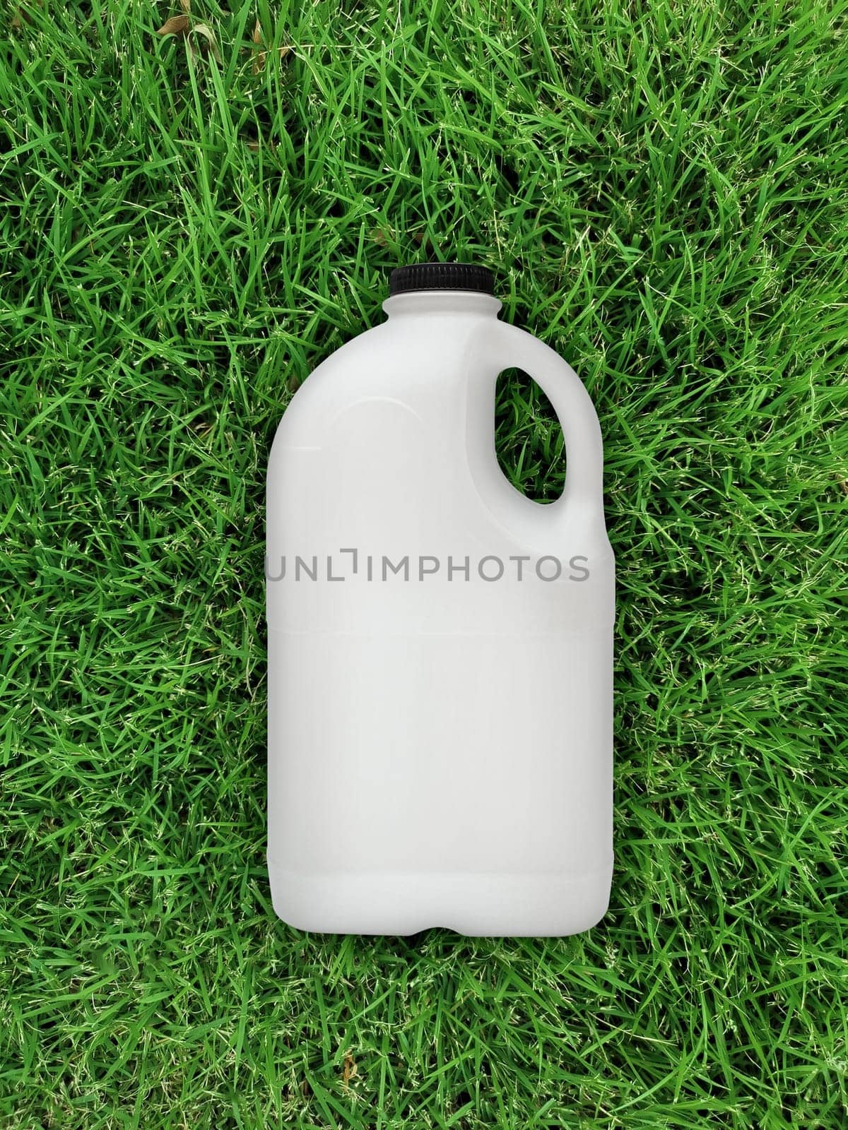 top view of milk bottle on the grass