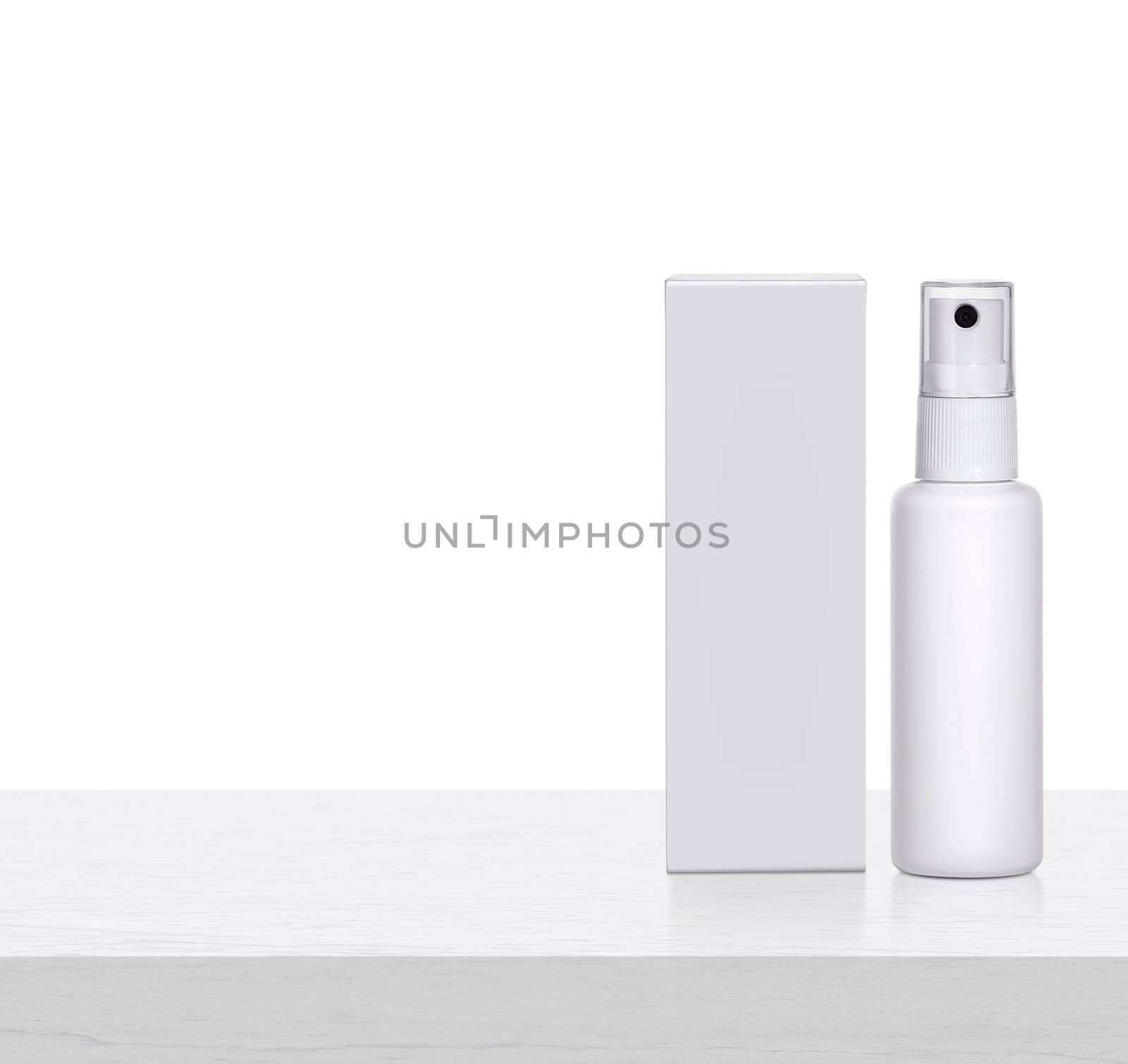 Plastic spray bottles blank and packaging on white wooden table. for packaging design