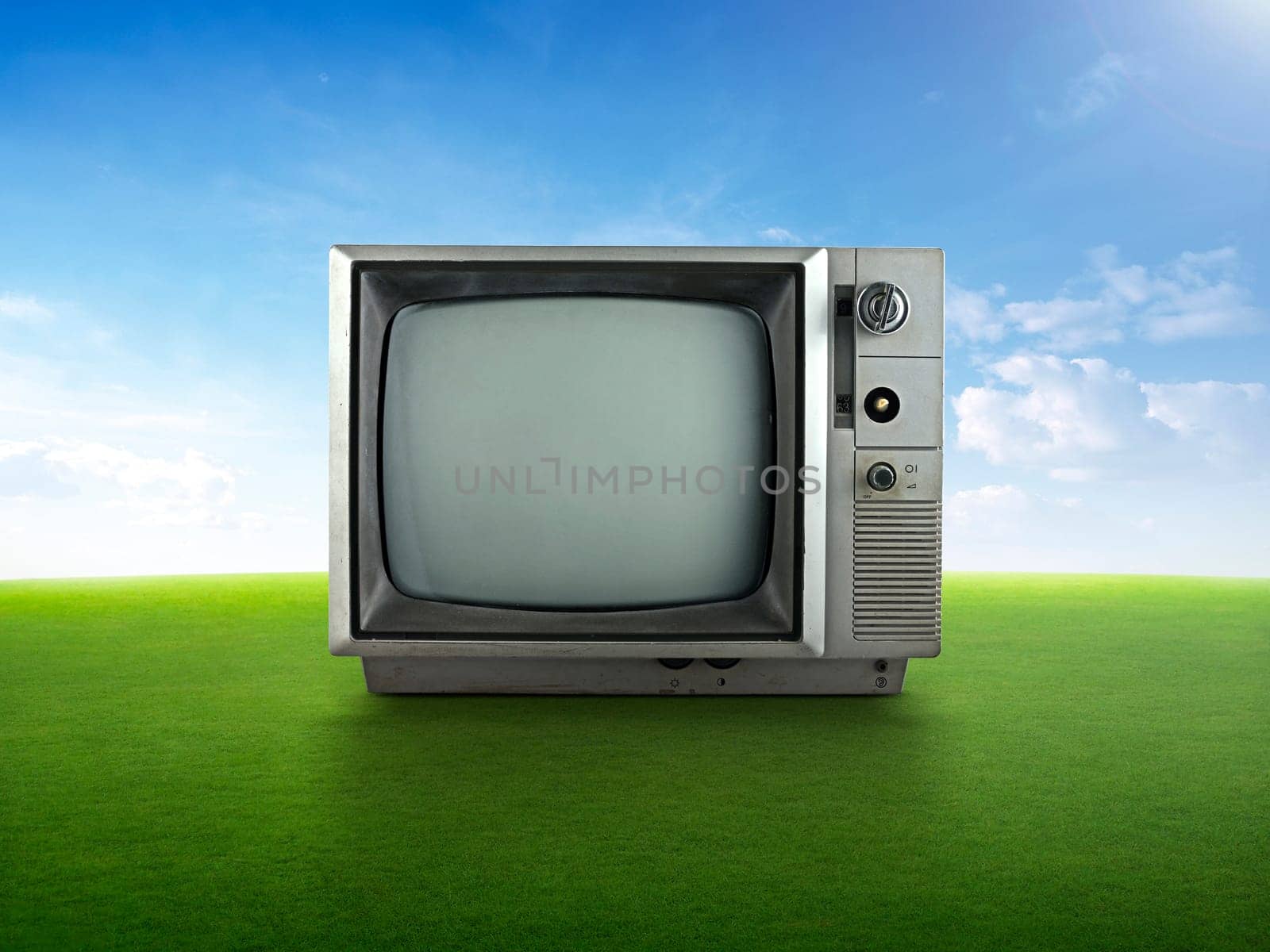 Vintage retro tv on grass