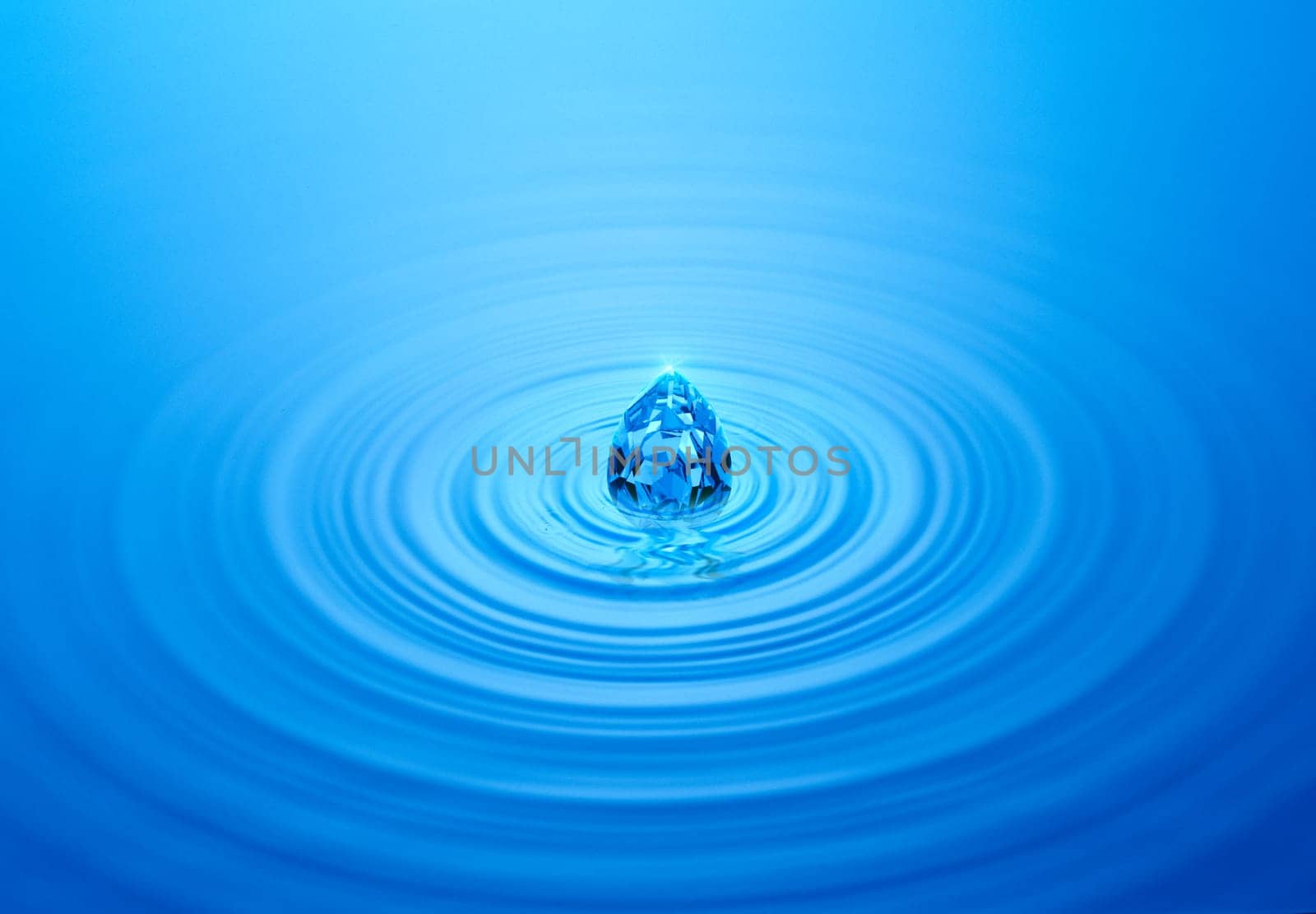 Blue diamond on rippled water with reflection