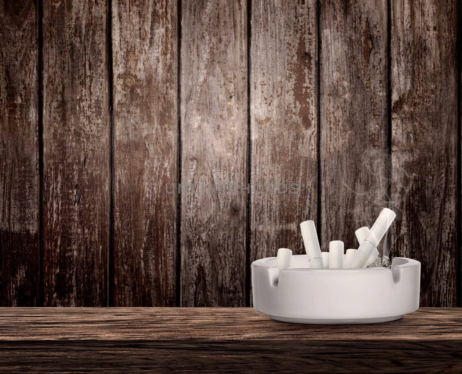 Ashtray full of cigarettes butts on wooden table