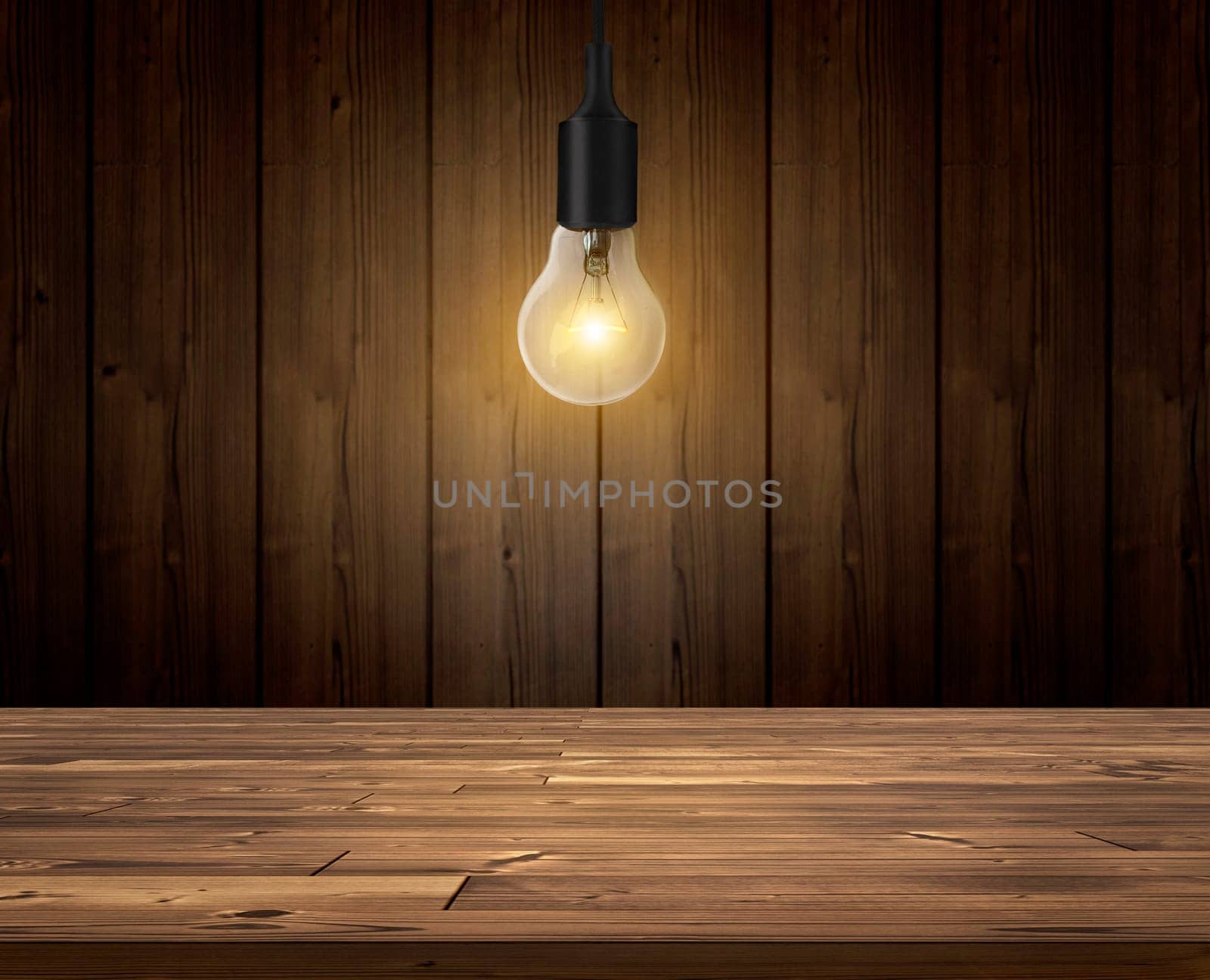 Light bulb with wood wall background, wood table