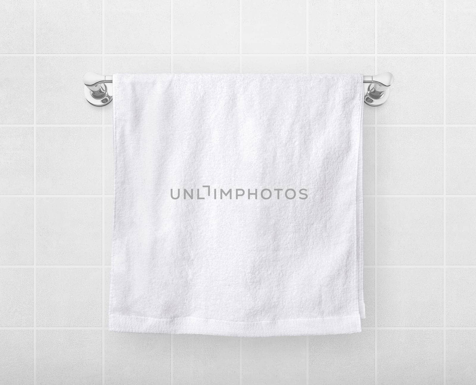 White towels hang on a hanger rod.