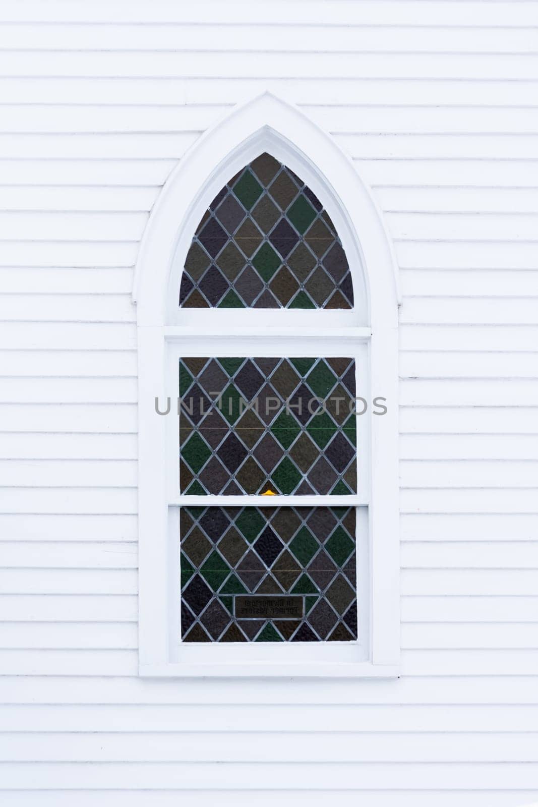 Beautiful Stained Glass Window On Wall of Church.