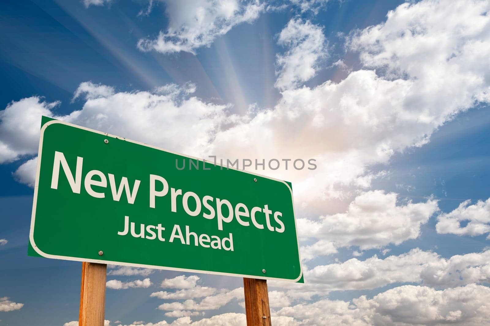 New Prospects Green Road Sign Over Sunny Dramatic Clouds and Sky.