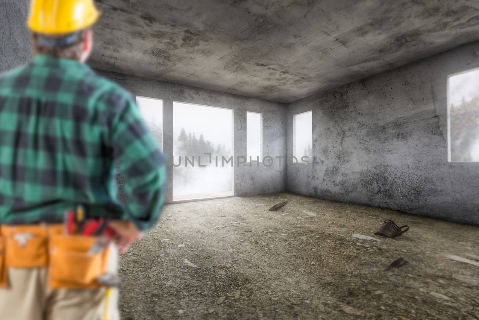 Contractor In Hard Hat and Construction Belt Facing Vacant Empty Abandoned Room of House.