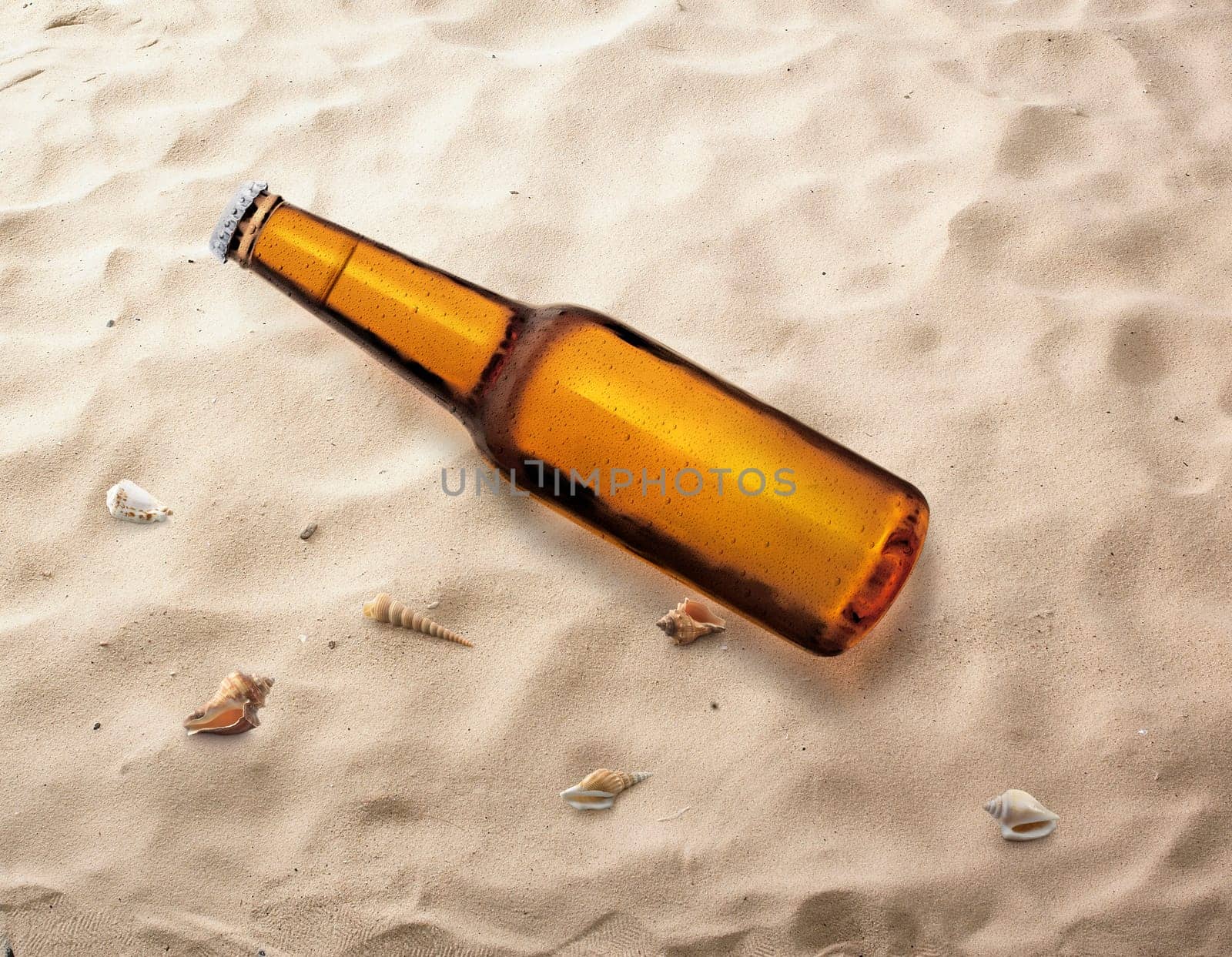 Bottle of beer on the beach being carried by sea waves to the shore