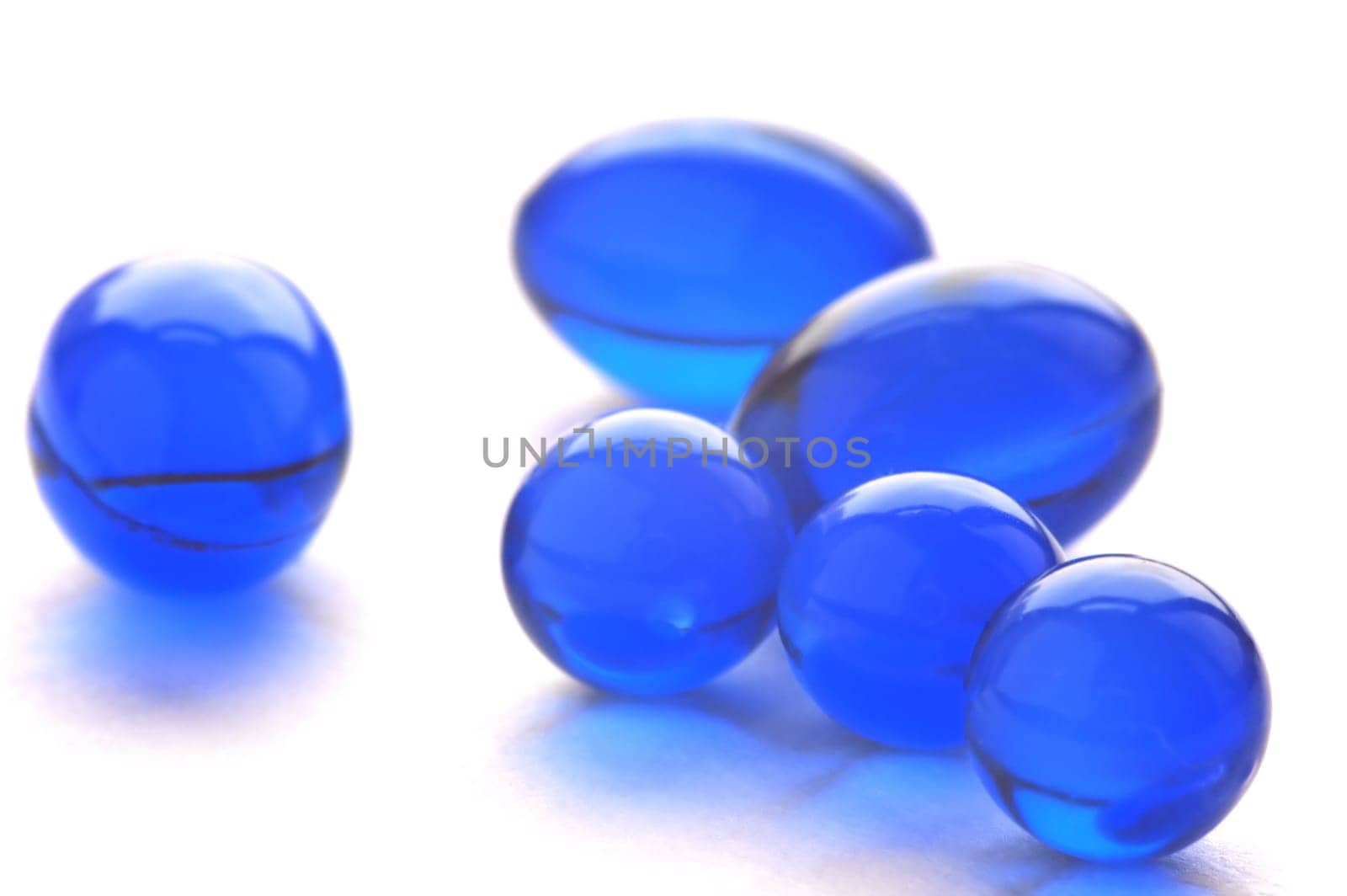An abstract picture of vitamins pills in blue color
