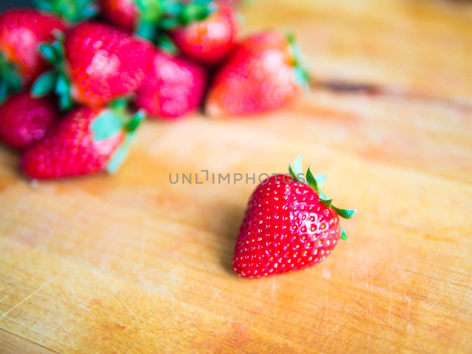 Fresh strawberry on a wooden board