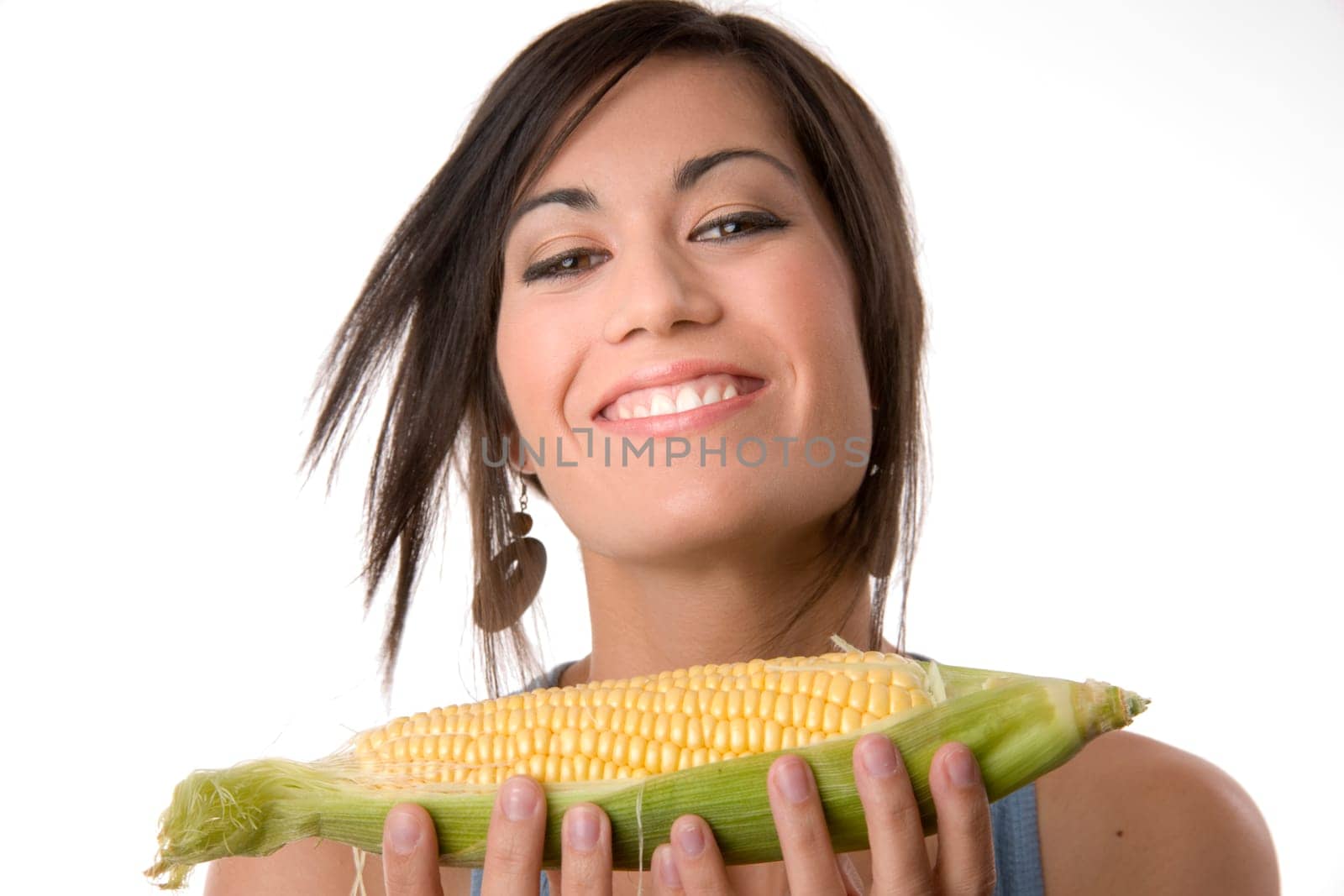 Woman Holding Raw Corn Stalk Looks Happy