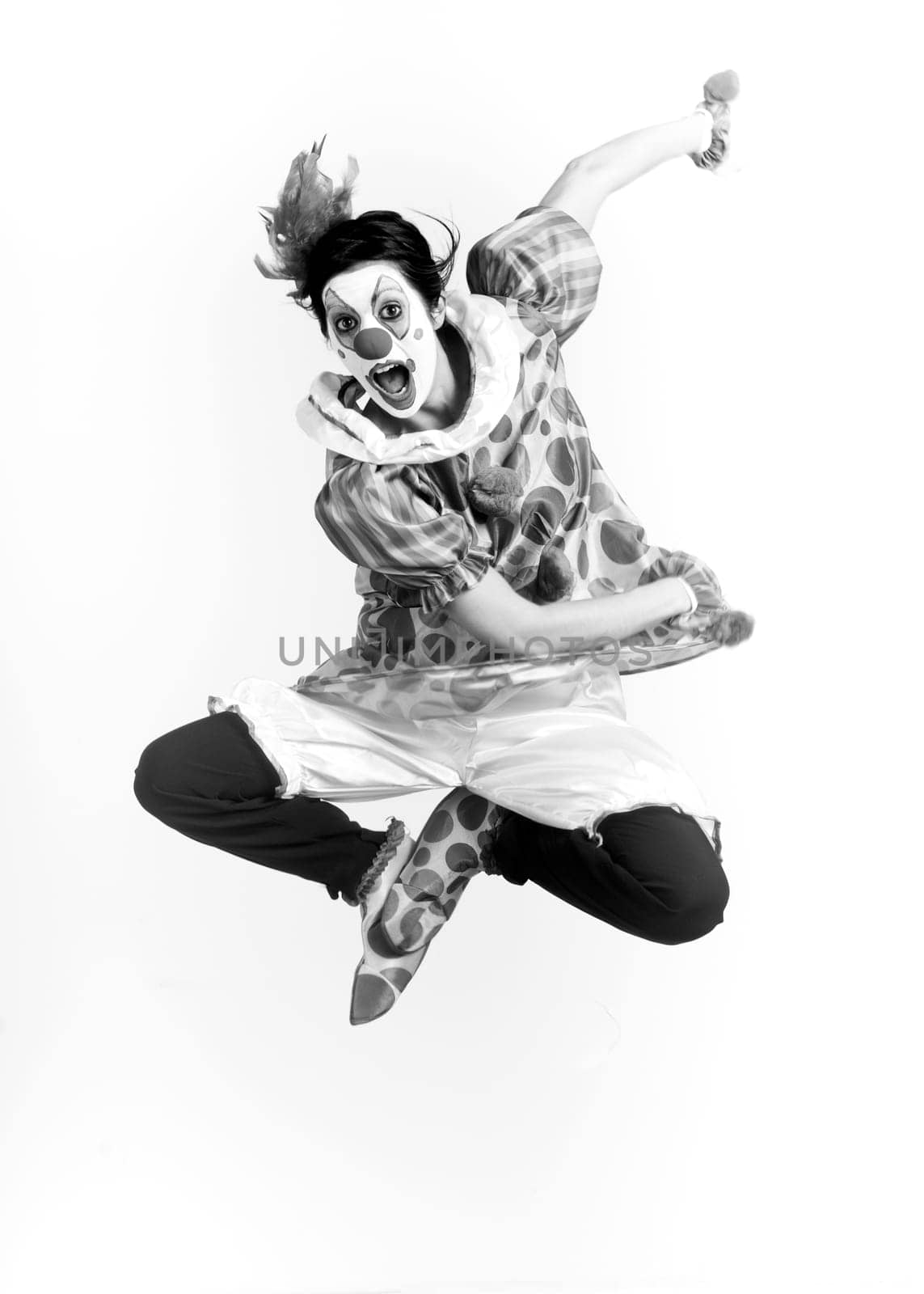 Monochrome Clown Flies Jump Dancing into Air During Performance
