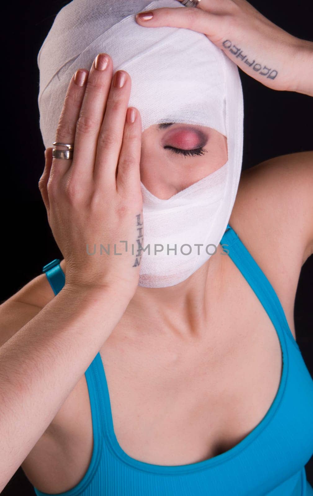 Woman in pain eyes closed holding head